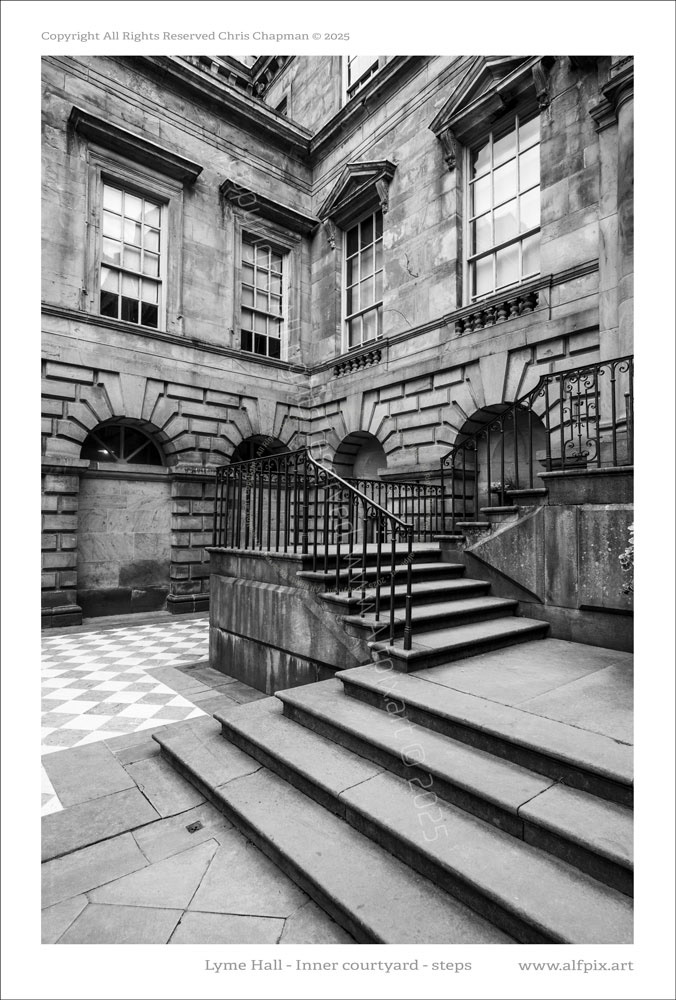Lyme Hall inner courtyard. Detail view of steps and corner stonework. Railings etc. Black and White image. 