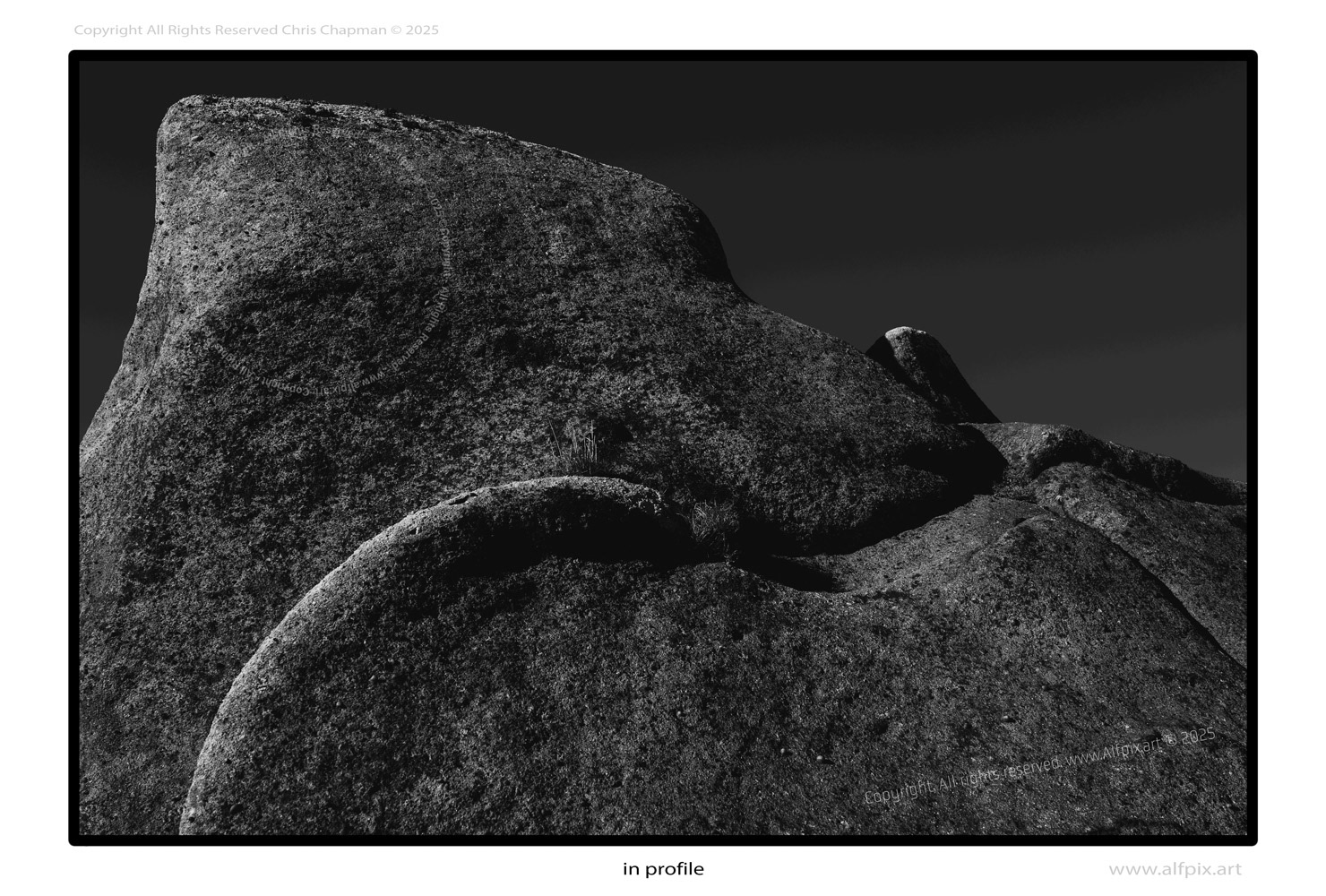 Monochrome image. Rocks in profile. 