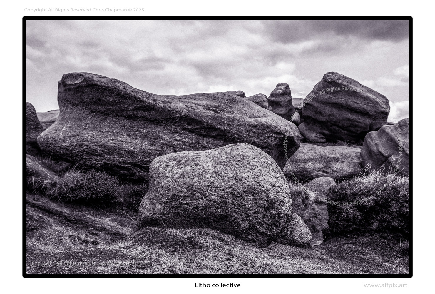 Woolpacks. Group of huge stones sat on the peat-grit surface of Kinderscout. Mono image. Cloudy sky. Overview shot. 