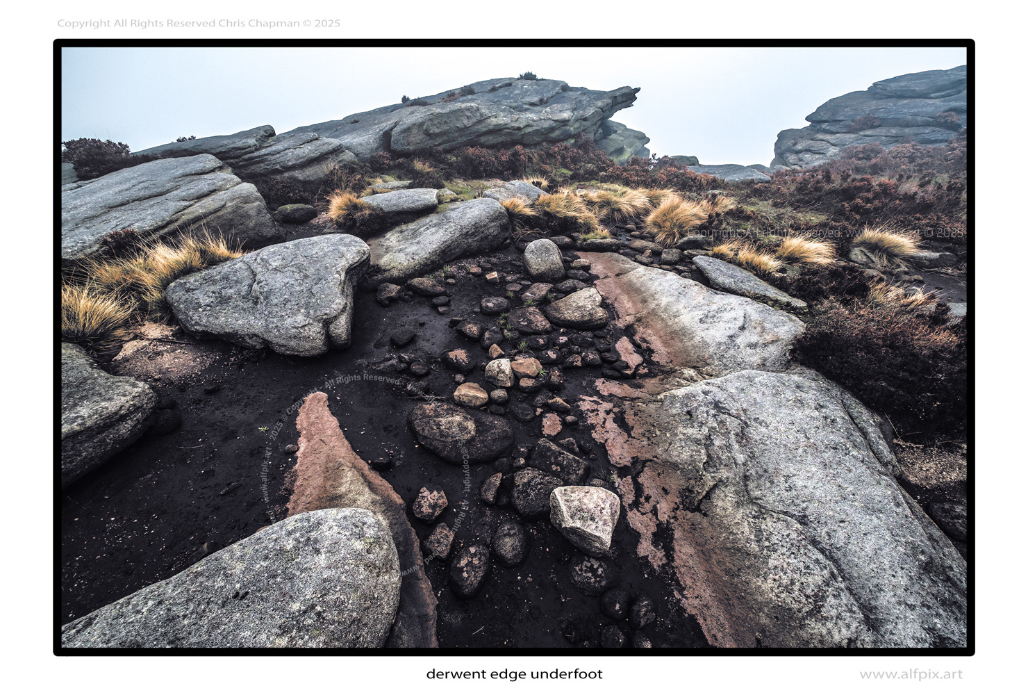 A typical scene wherever kinderscoutian gritstone rock is seen on the surface. Loose rocks scatter the ground. Bigger boulders randomely lie alongside larger fixed monoliths. Peat soil is evident. It's a challenging envrionment to walk on, requiring concentration and care. alfpix.art Chris Chapman. colour image. 