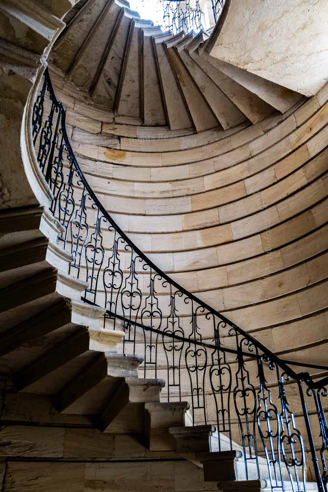 Spiral staricase. Stone walls finely worked. Iron railings.