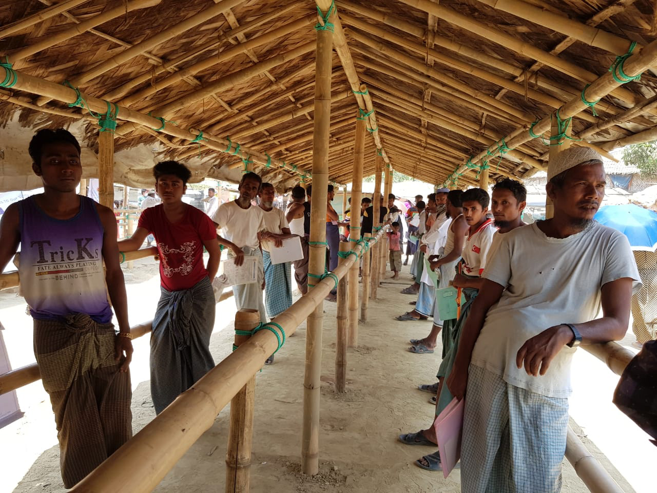 Dil Kayas - socially distanced queue for rations