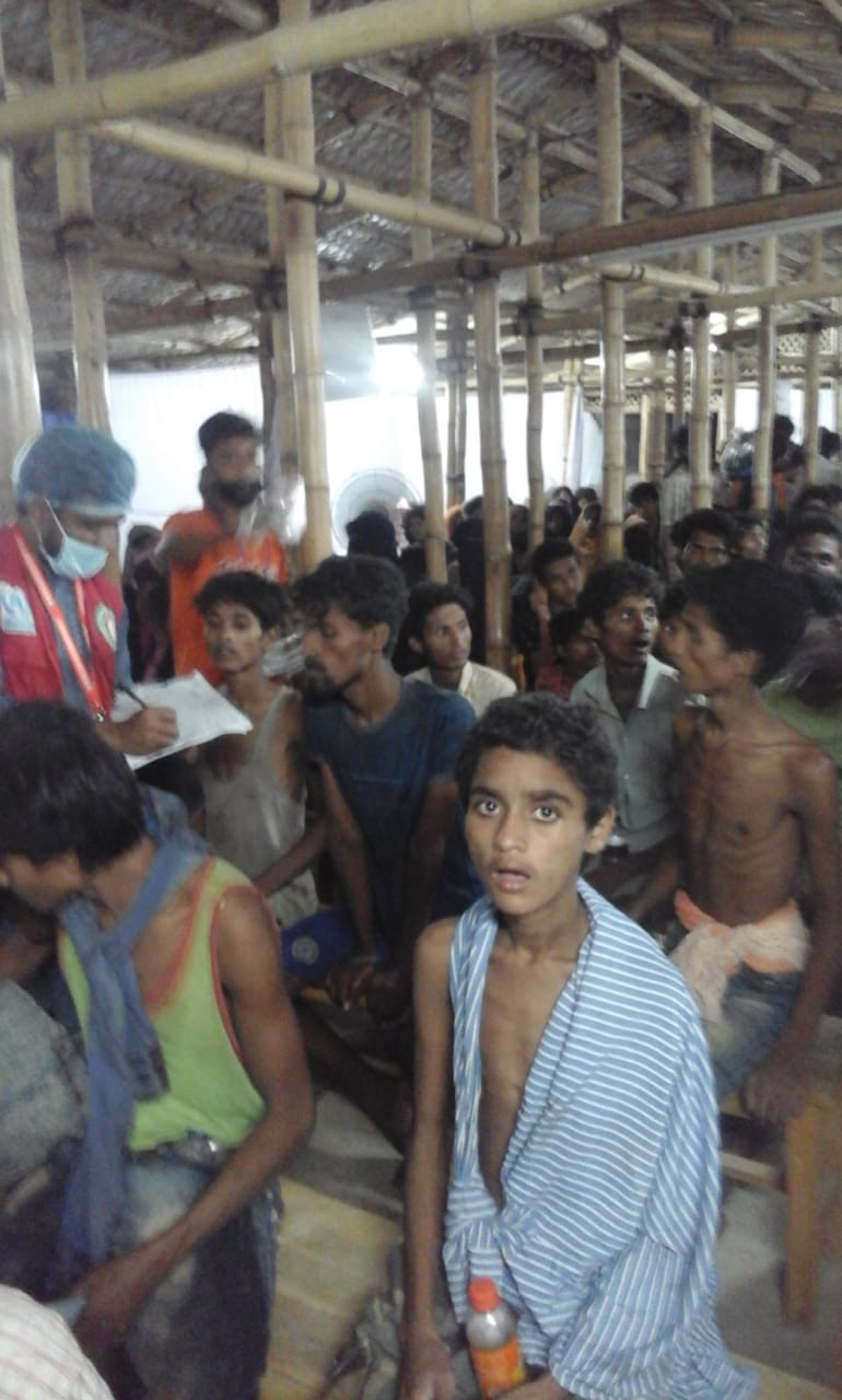 Boat survivors being screened (Withheld)