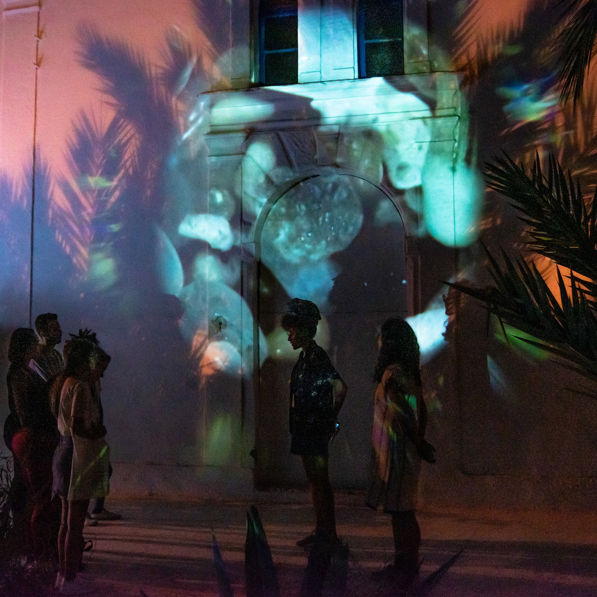 Tunisian guides explain aspects of the work and escort visitors through the experience.