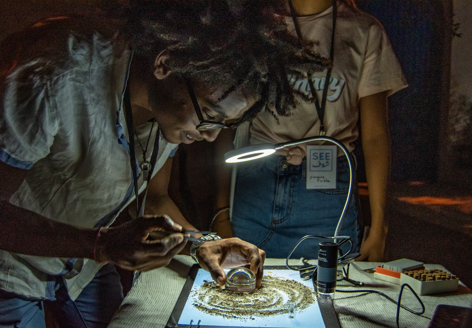 Each visitor is asked to choose one grain of sand from Djerba.