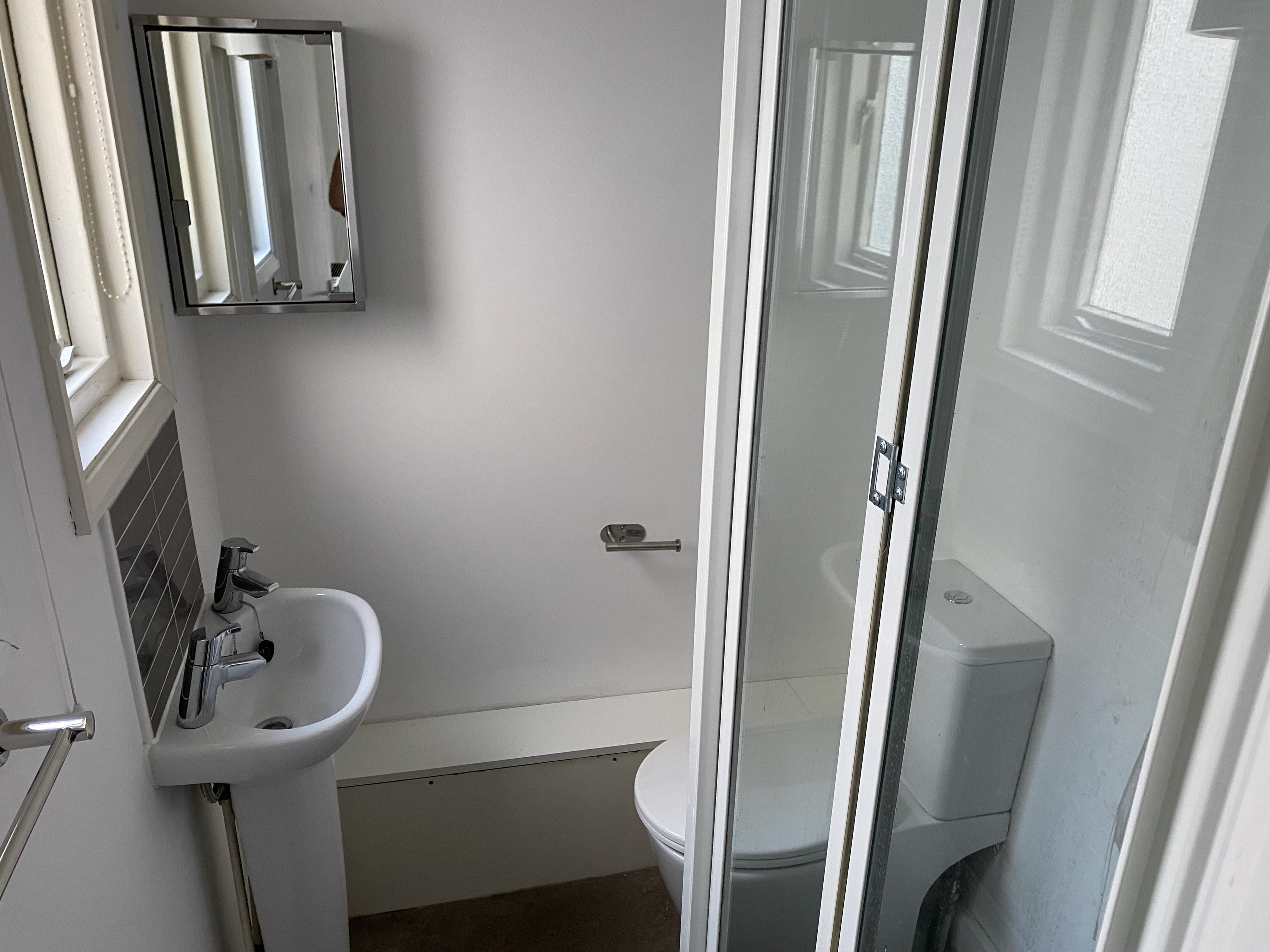 Bathroom: medicine cabinet, shower