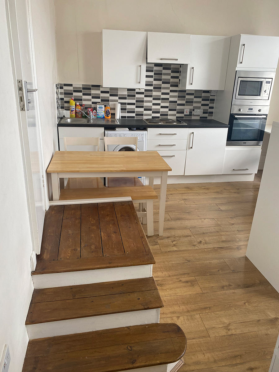 Washer/dryer, dining table, fridge, oven, microwave