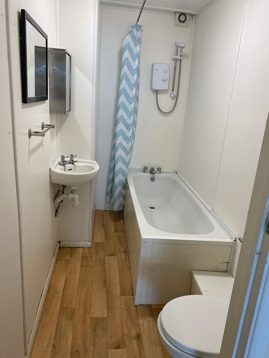 Bathroom: medicine cabinet, bath, shower