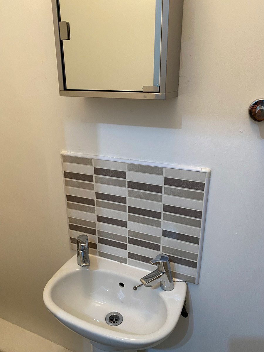 bathroom: sink, medicine cabinet