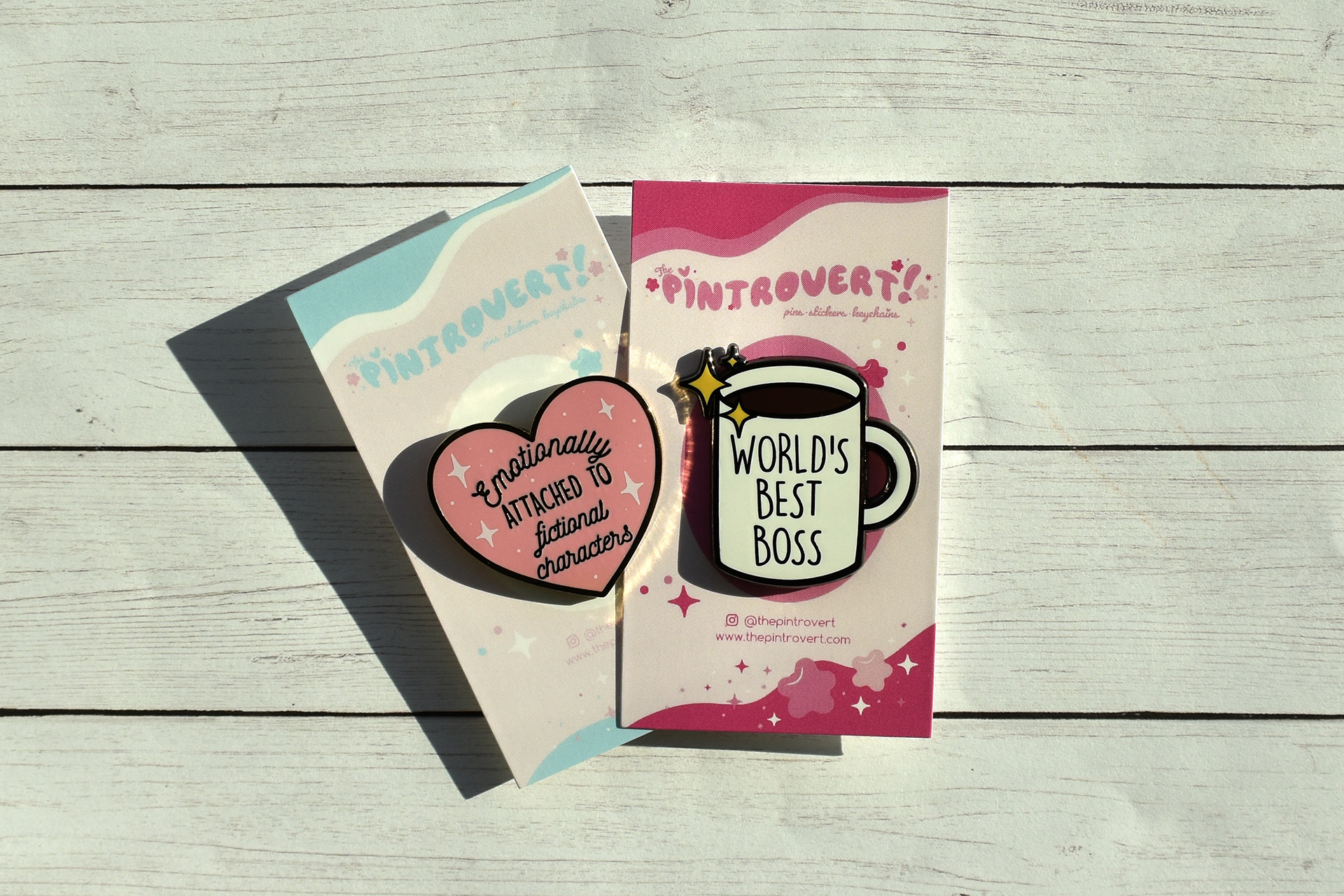 Pins are framed by the design elements of the cards.