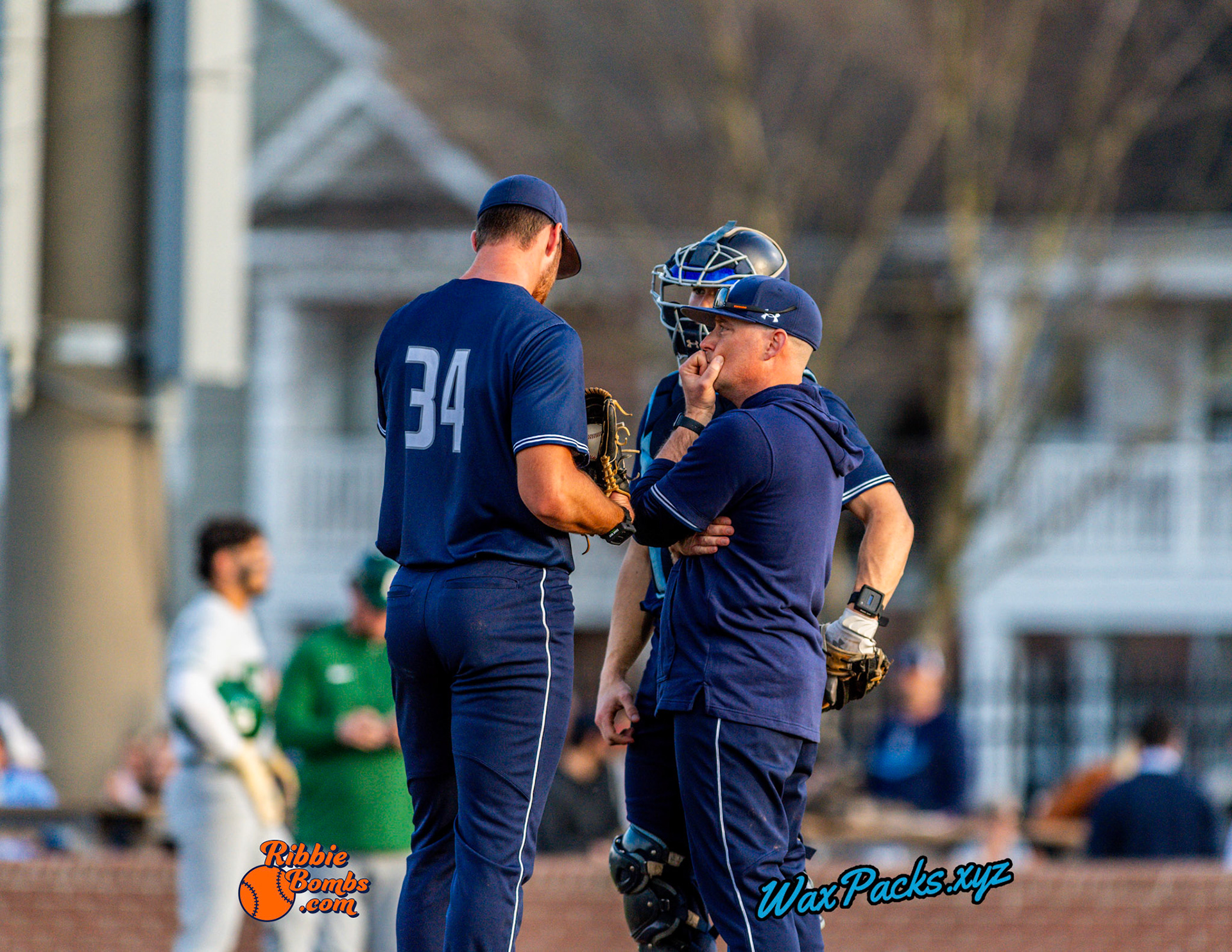 Pitcher Dylan Brown (34) of Old Dominion talks with Assistant Coach / Pitching Coach Mike Marron in the second game of a 3-game weekend series. The Monarchs defeated the 49ers, 4-1, at Bud Metheny Baseball Stadium on the campus of Old Dominion University in Norfolk, VA, on Saturday, March 2, 2024.  (Photo Credit Chad W. via www.WaxPax.xyz via Getty Images, Copyright © WaxPacks.xyz WaxPacks.xyz™ 2024)
