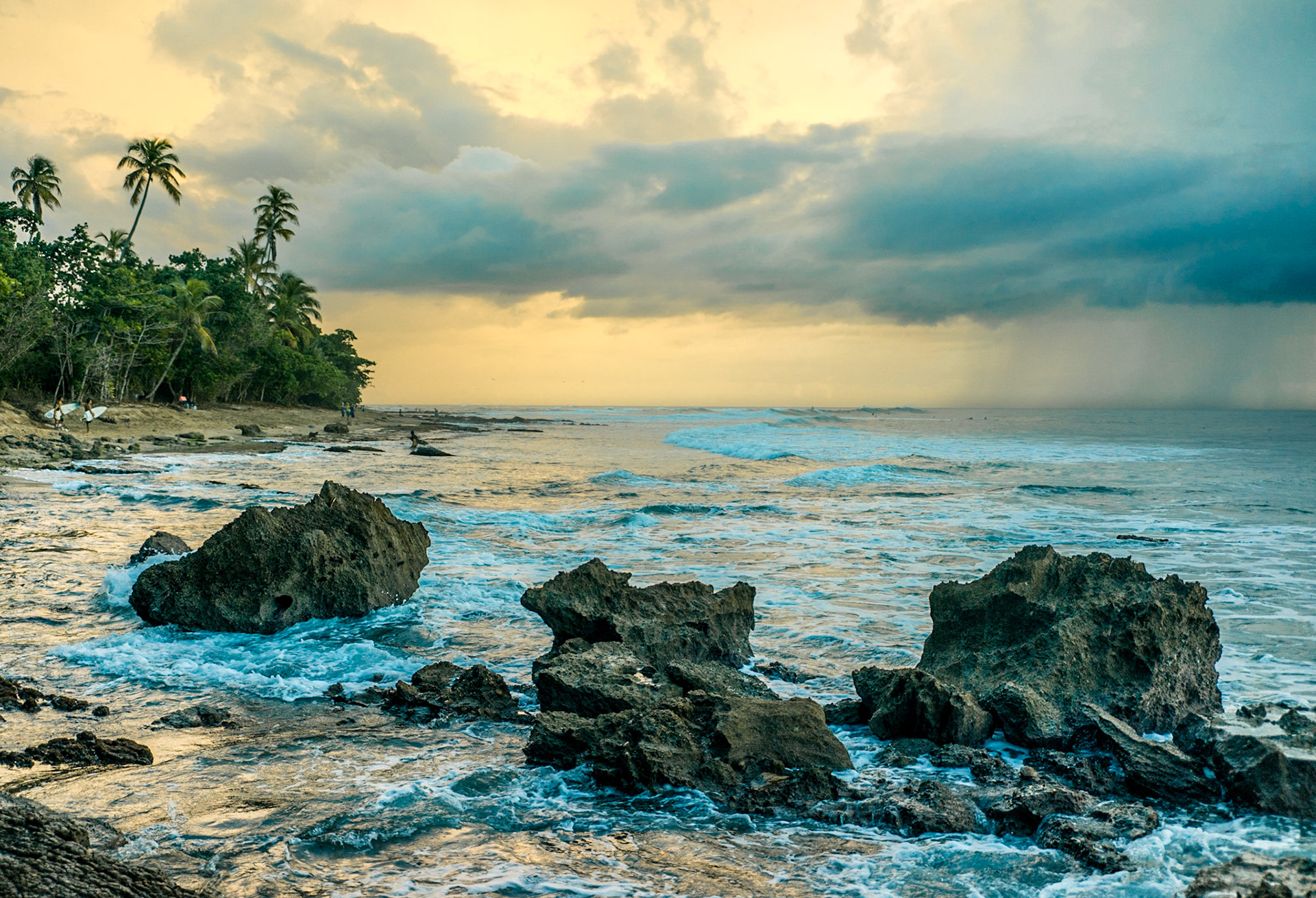 Surfing in Rincon Puerto Rico... Awesome sunset near a rocky beach