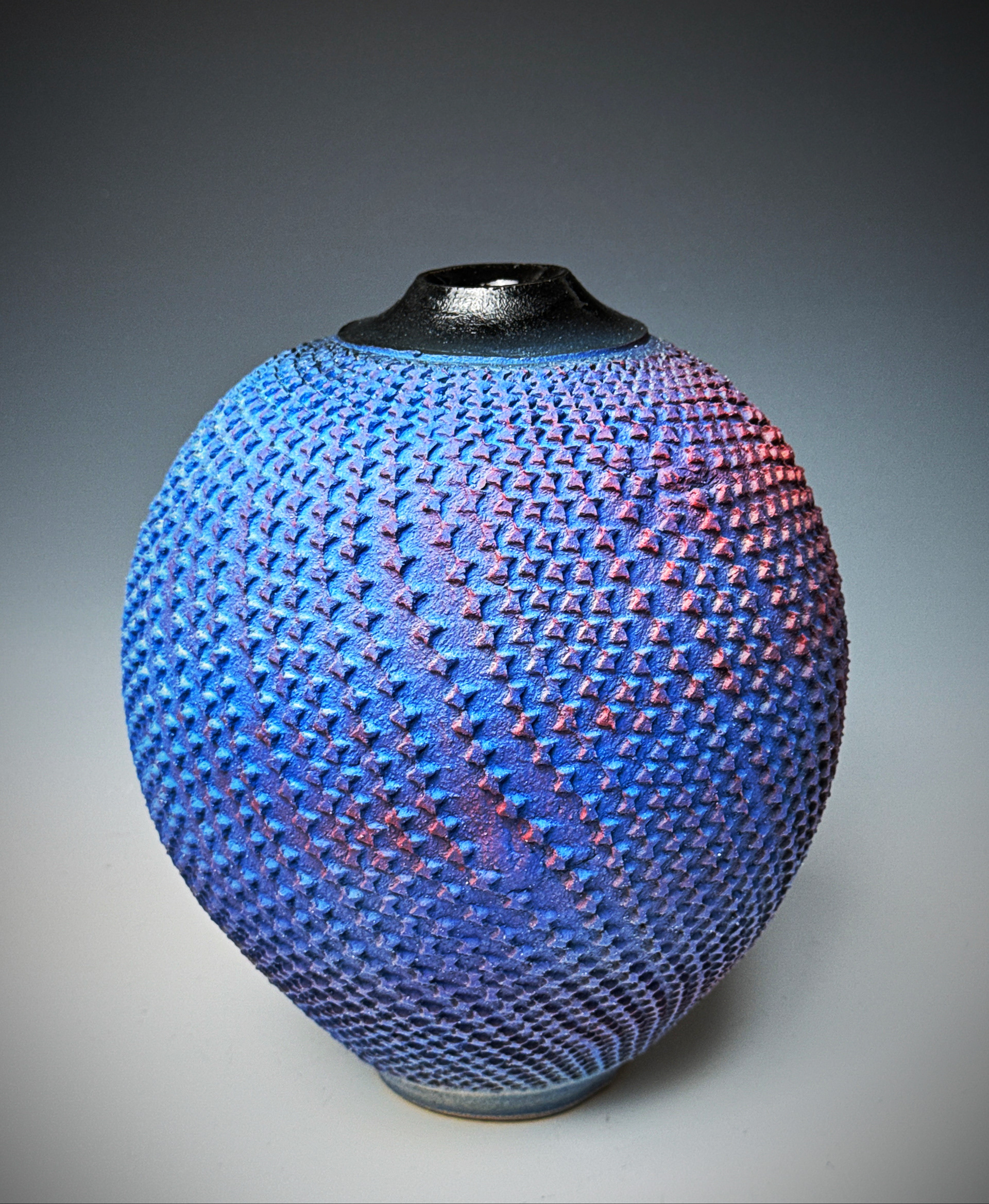As this piece is turned the right side always stays red and the left is blue