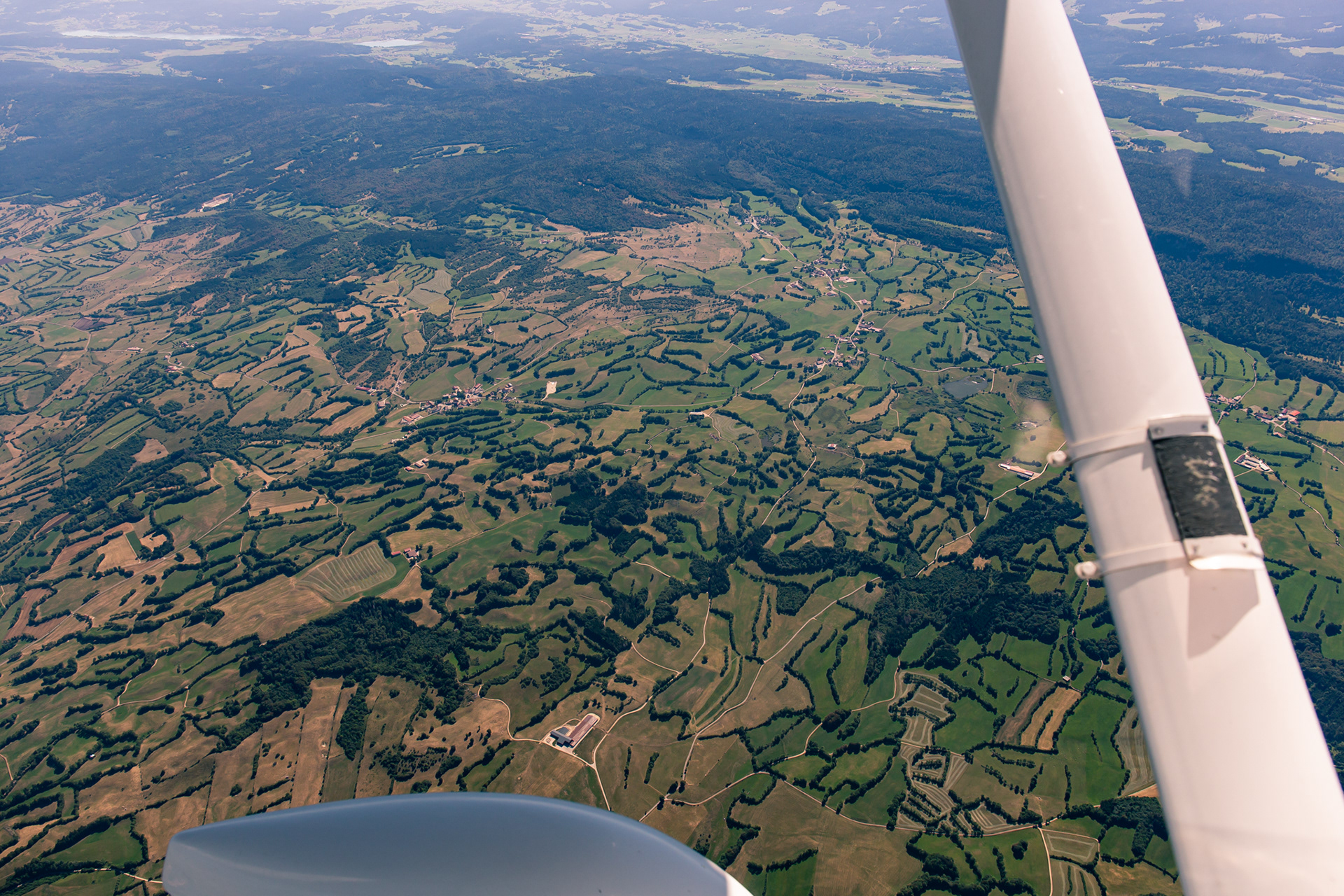 Rising terrain below us, the vegetation changing slowly to smaller plants and trees.