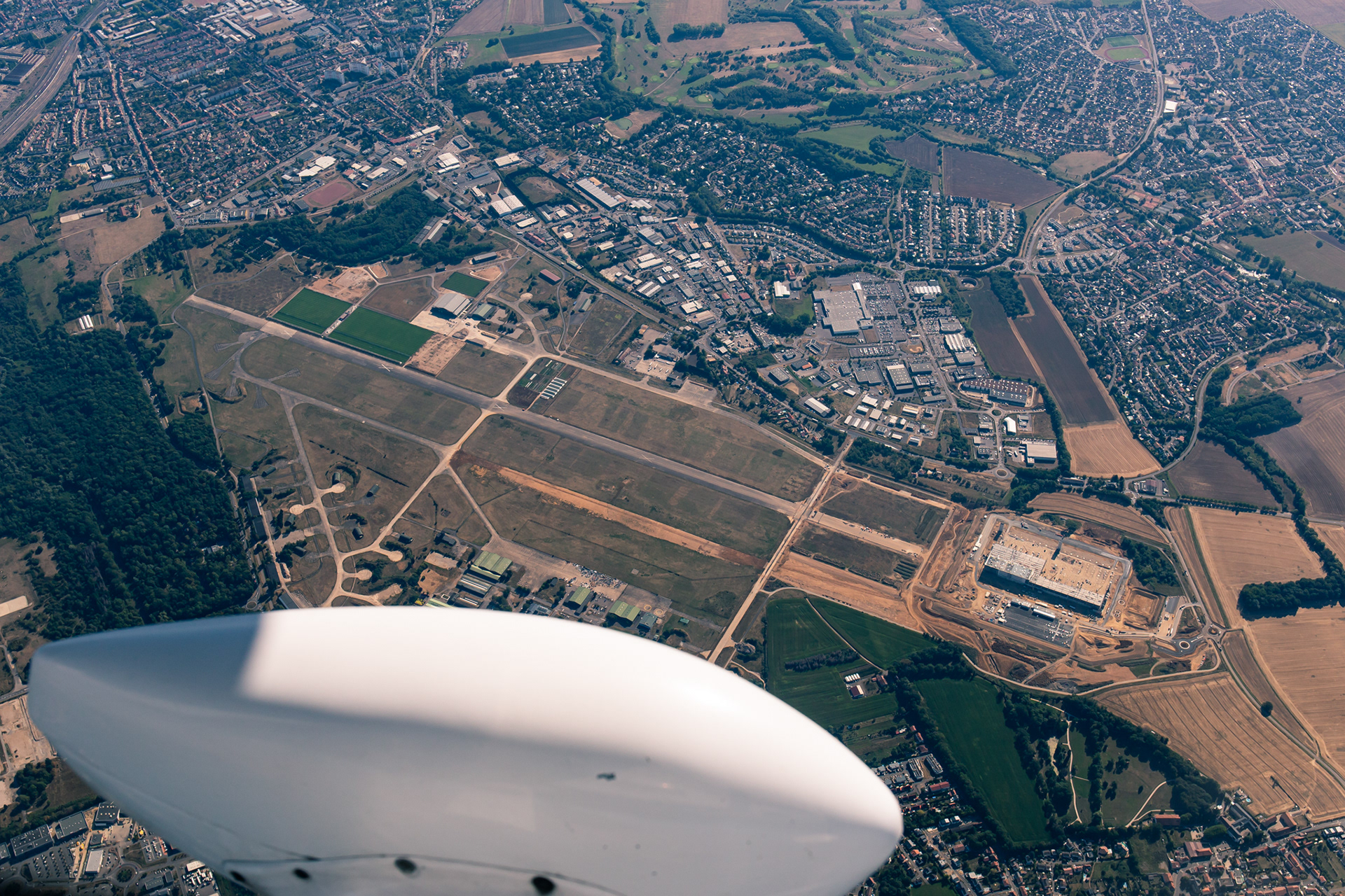 A former french military fighter jet airbase passing below us.