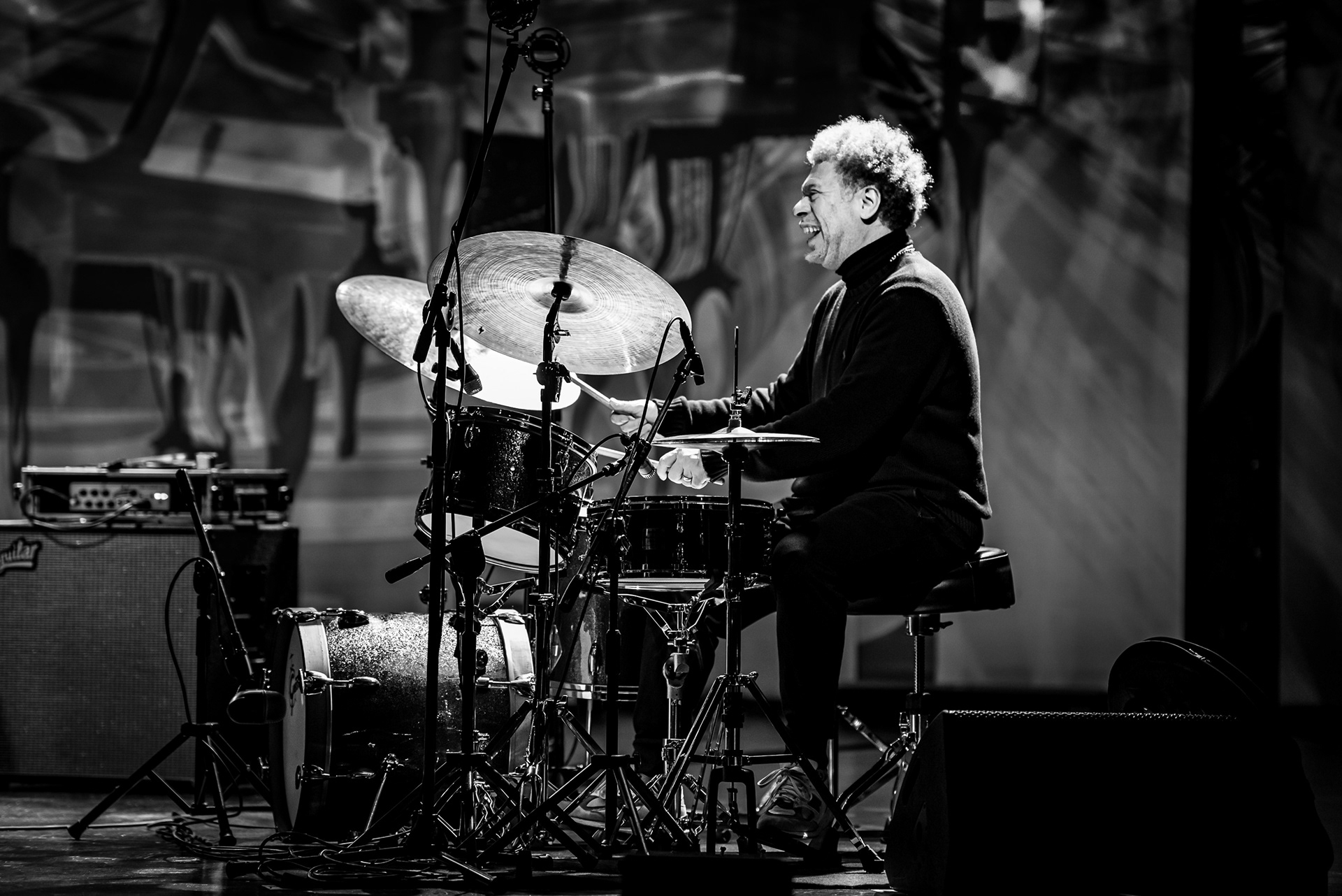 Lukmil Pérez in a moment of rhythmic trance, close-up jazz percussion documentation, International Jazz Pianists Festival, captured by Szymon Ratajczyk.
