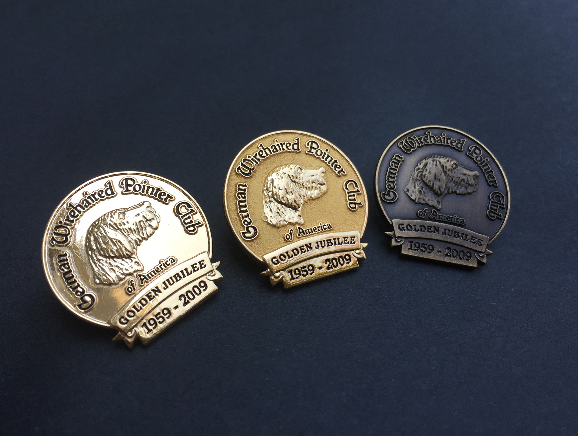 Custom lapel pin design I created, in three different metal platings to signify levels.  I worked directly with this client to create the concept, and then made the detailed specs for mass production.