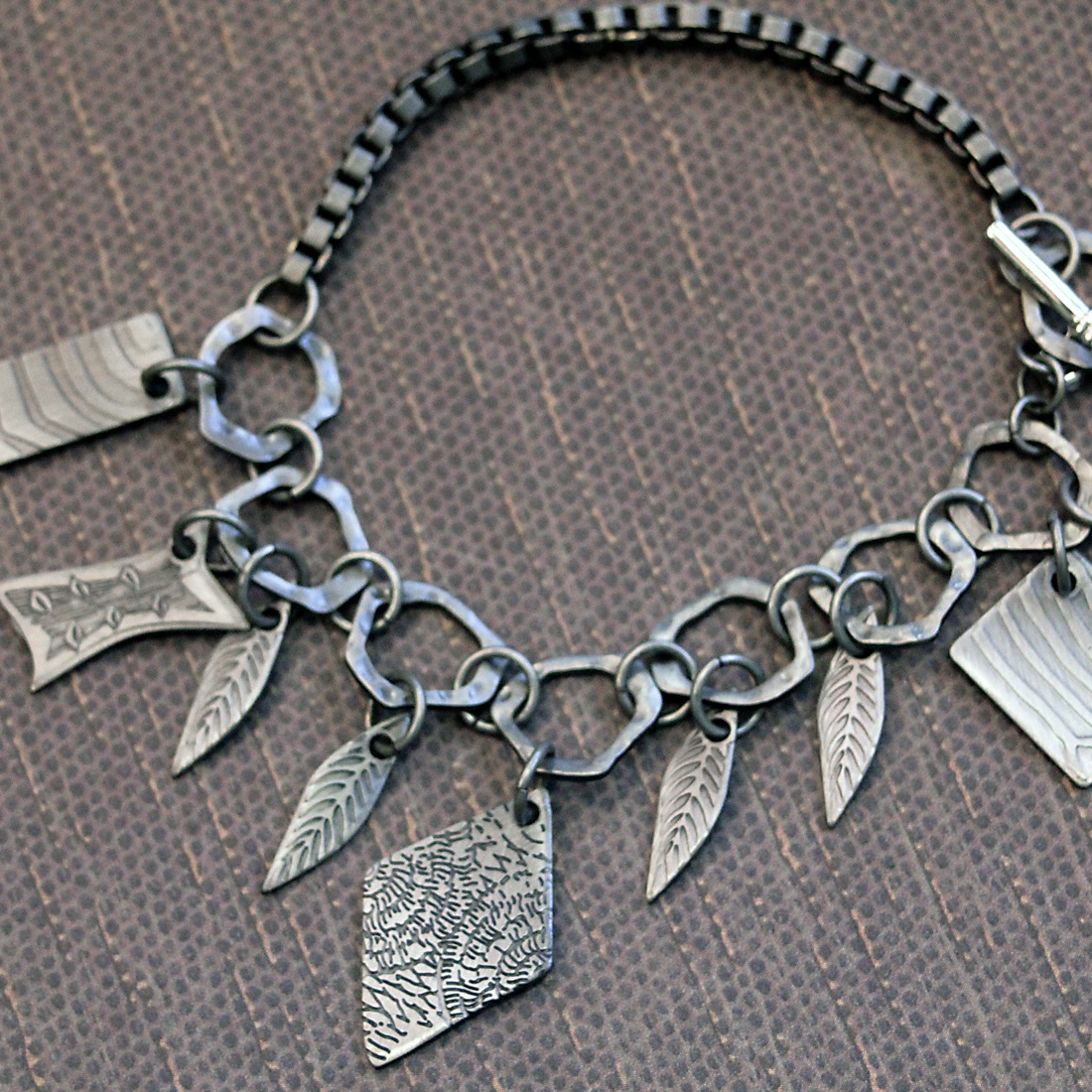 Bracelet design with 3D charm and link designs.  I created the concept, and technical specifications for manufacturing.