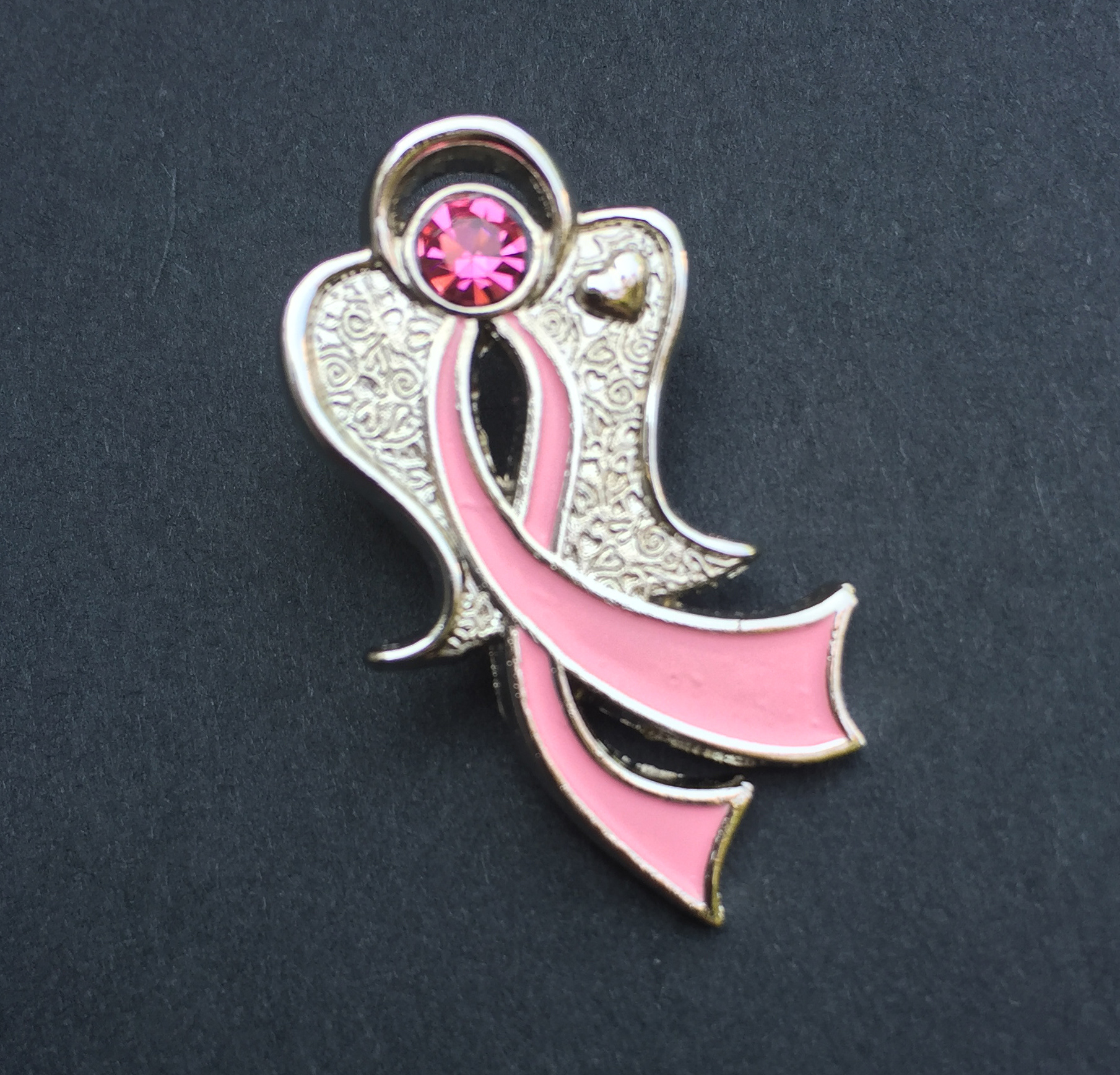 Upscale breast cancer awareness pin design.  I created the design, and set up the technical specifications for manufacturing.