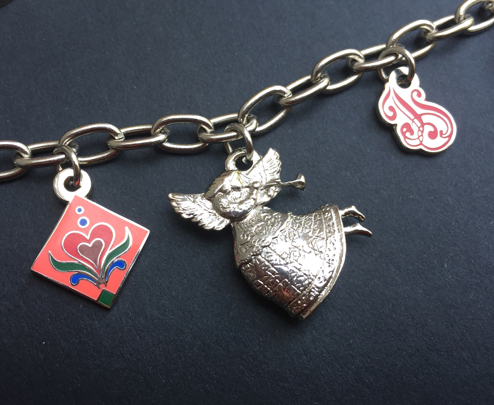 Charm designs in imitation hard enamel, and cast processes.  I worked with the customer to take their design idea and create the technical specifications for production.