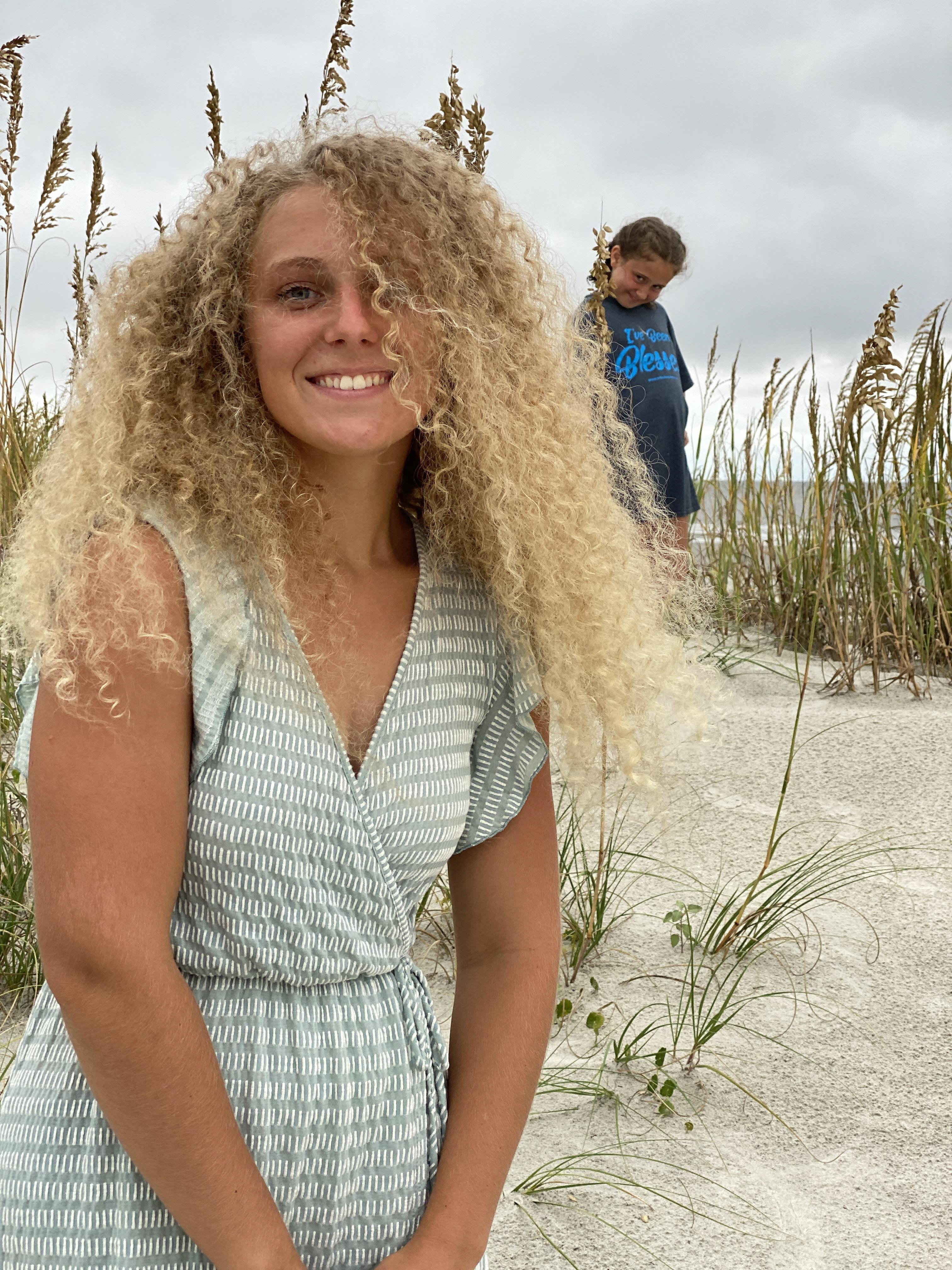 Livi "photobombing" Audrey's Senior portrait