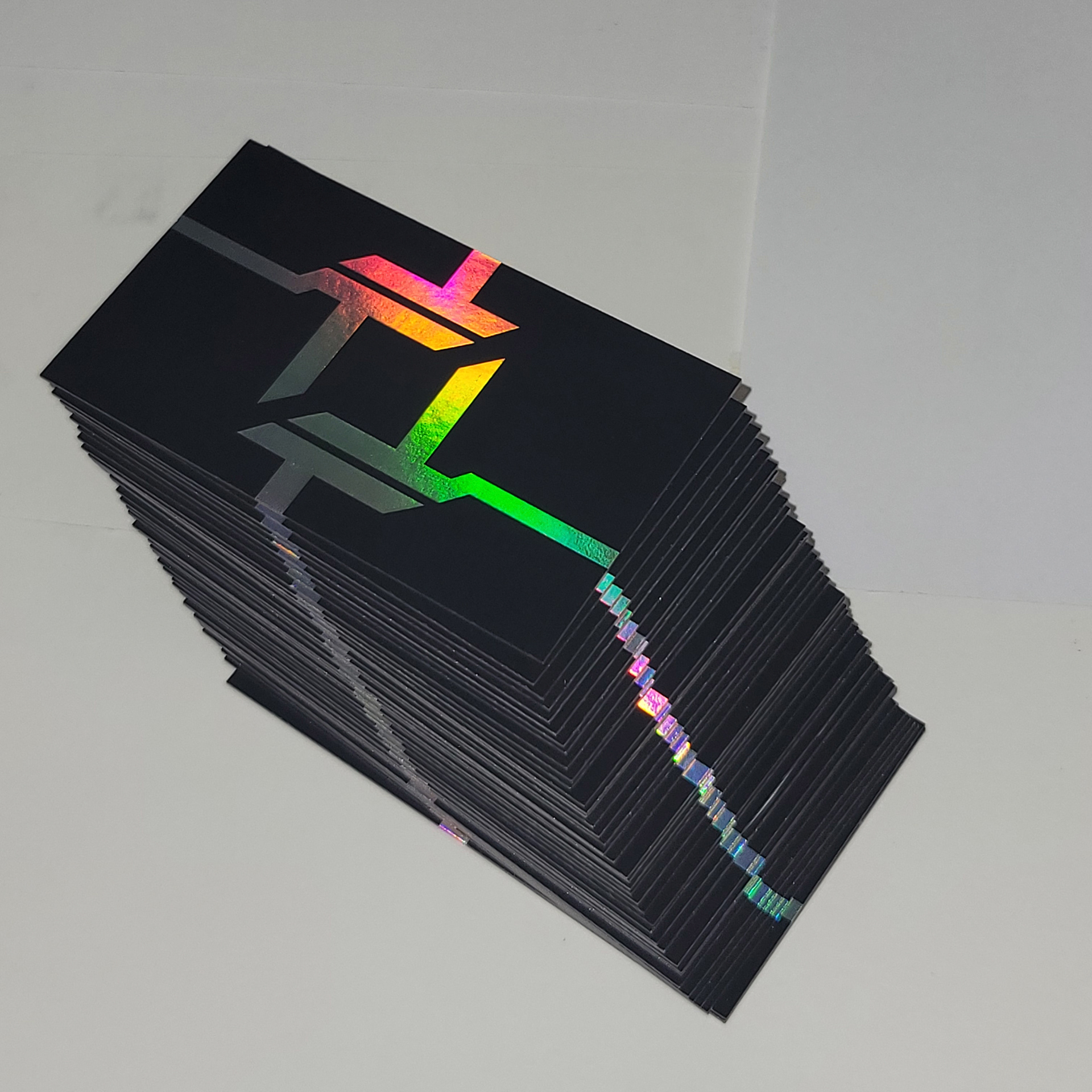 A shot of my business cards in a staircase arrangement. Note the holographic foil on the bottom and right of the cards.