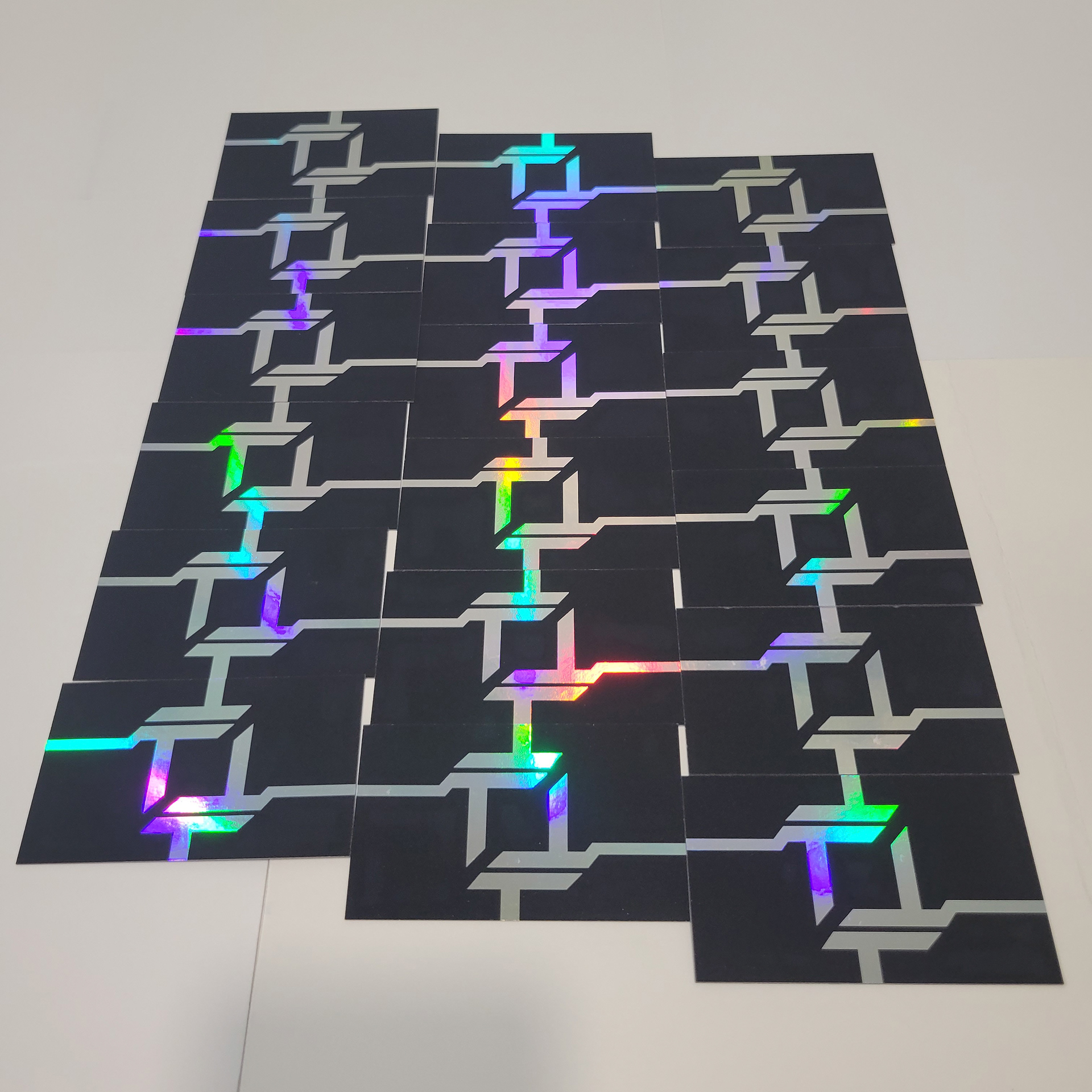 A shot of my business cards, taking advantage of the holographic foil's effects.