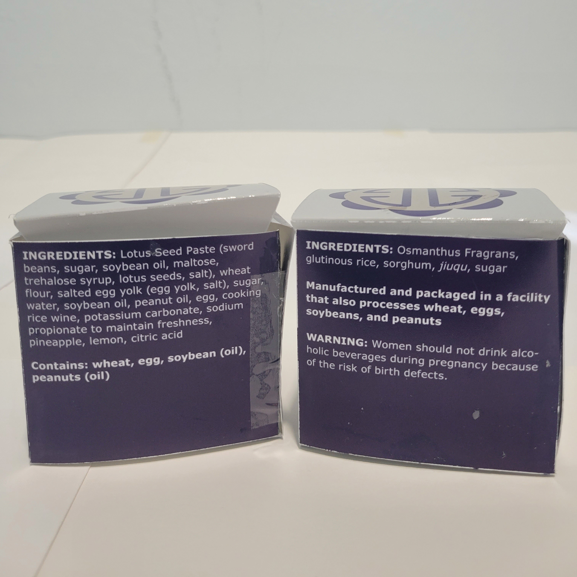 On the back of each box are ingredients and warnings for allergens and alcohol.