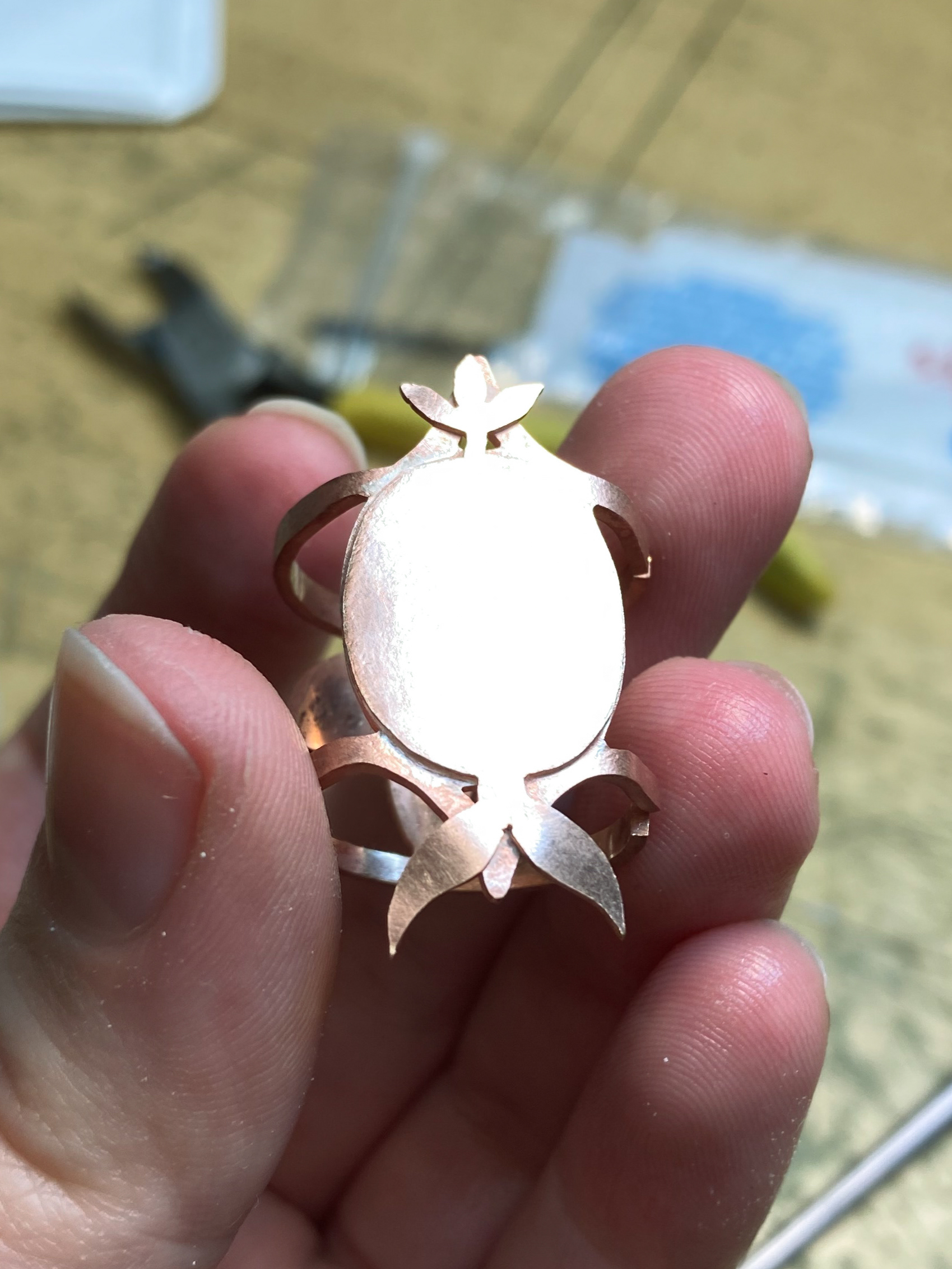 Decorative plate soldered to ring base