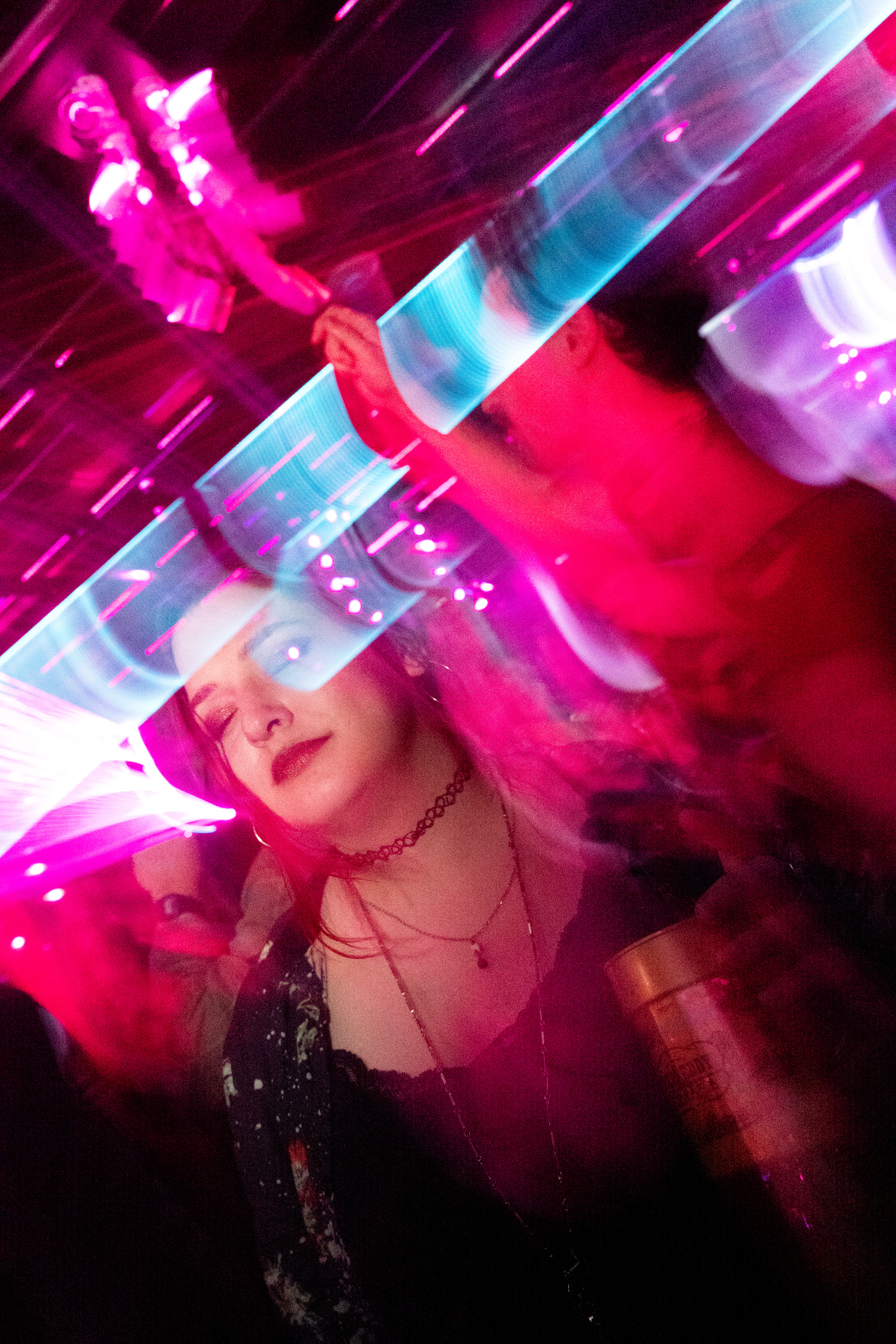 A party attendee relaxes her eyes and dances under laser lights to house music on Thursday, March 5, at Harpo’s Bar & Grill in Columbia, Mo. As the night went on, partygoers were visibly tired but continued partying.