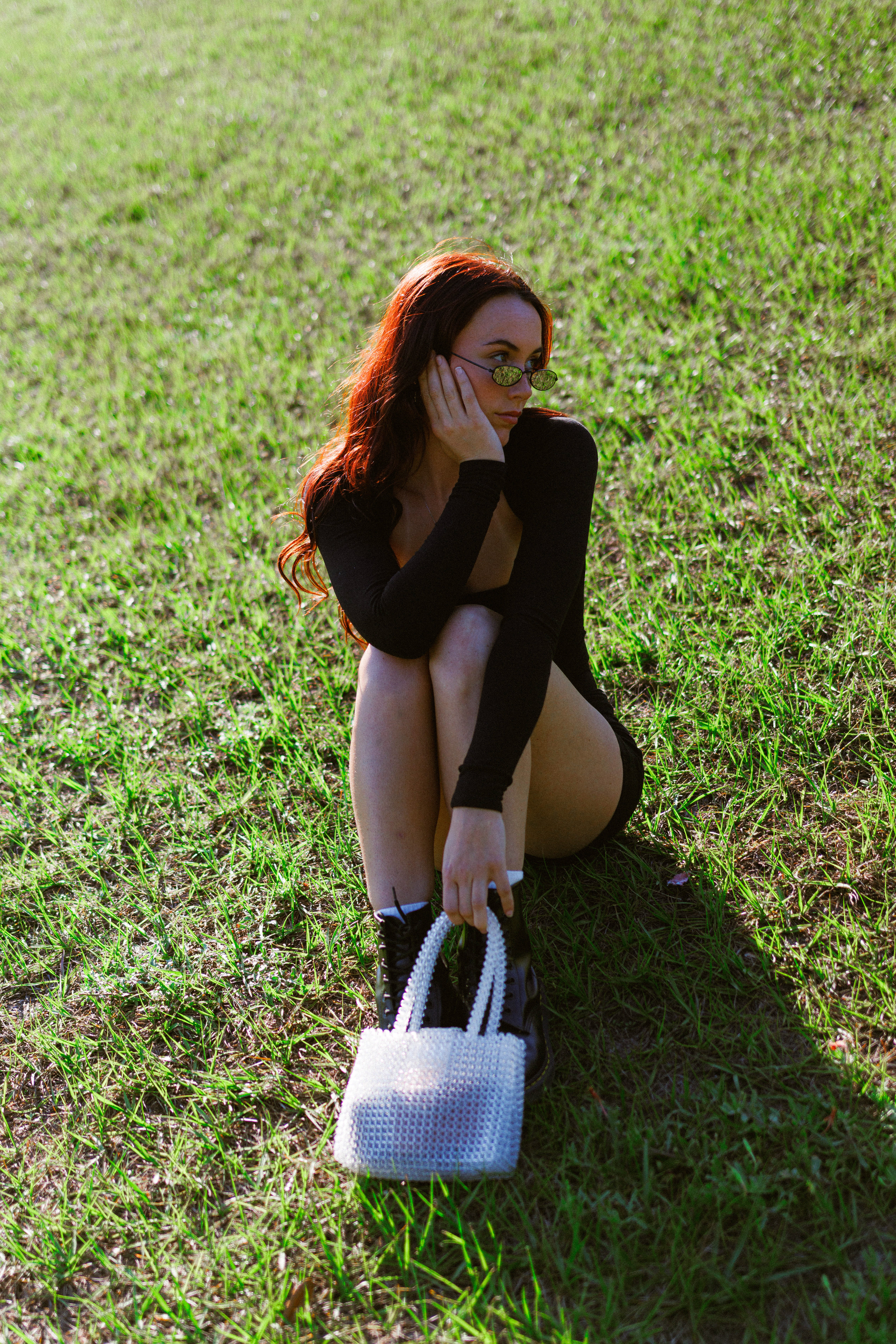 Meghan | Outdoor sunny fashion photoshoot with y2k vintage sunglasses, bodysuit, white purse | Outdoor sunny fashion photoshoot with y2k vintage sunglasses, bodysuit, white purse | Outdoor sunny fashion photoshoot with y2k vintage sunglasses, bodysuit, white purse full-body