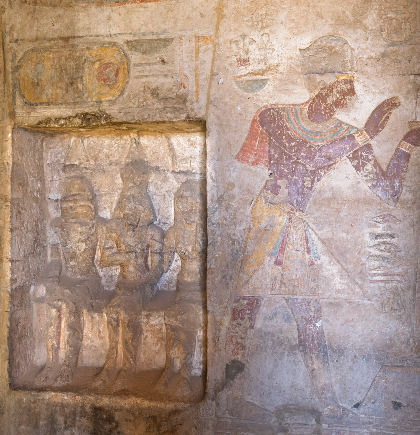 Niche containing statute group of Ramsesses II between Horus and Isis