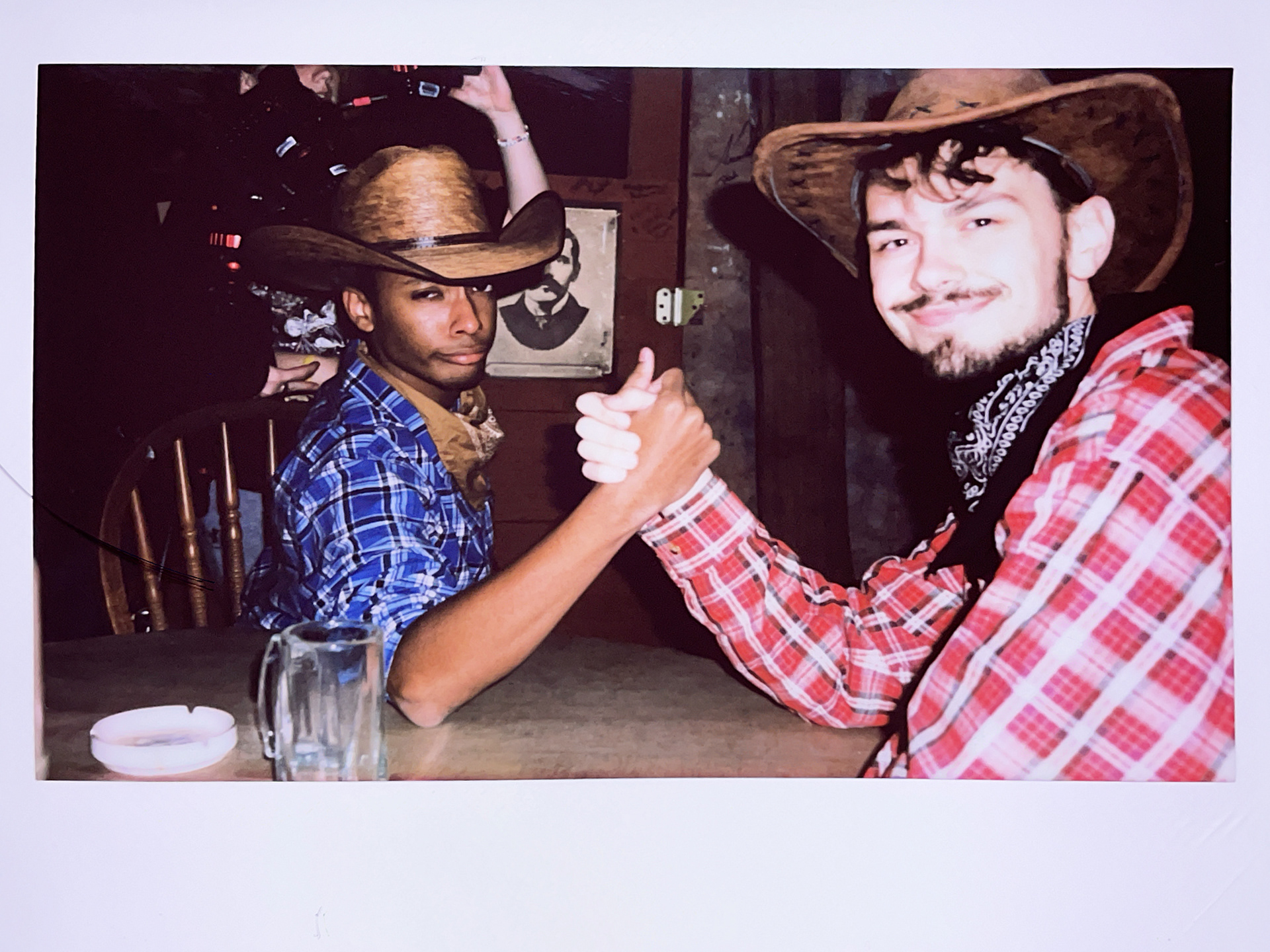 Drew and Alec arm wrestling Polaroid