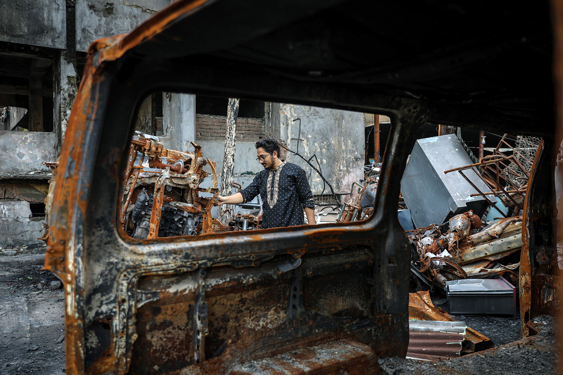 A police station in Dhaka was burned down by a mob.