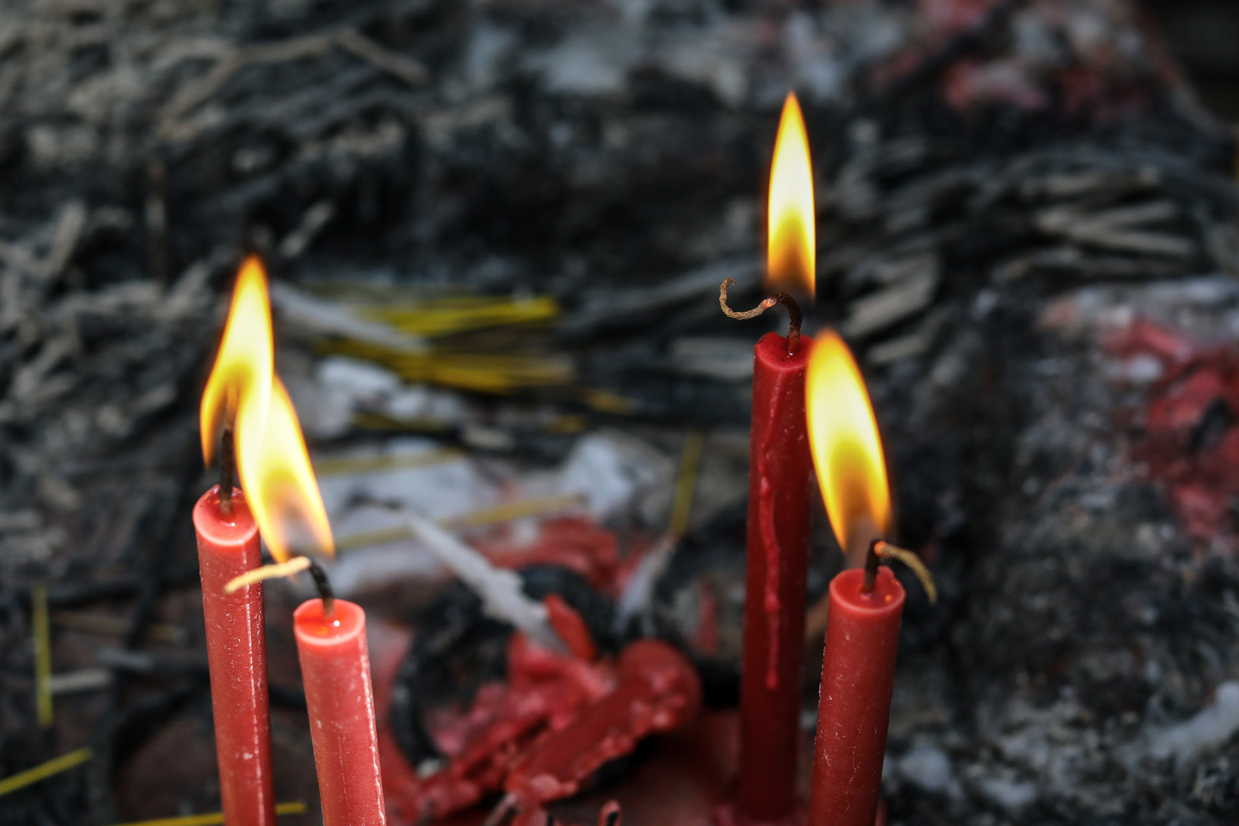 People light candles at a temple in Chittagong city.