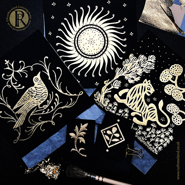 Photo of several gilded artworks for a gilded illustration masterclass at The Wallace Collection. Gold leaf on black paper inspired by decorative Indian metalwork, the sun, a bird, a tiger and decorative patterns. © Ruth Rowland Lettering Artist & Illustrator