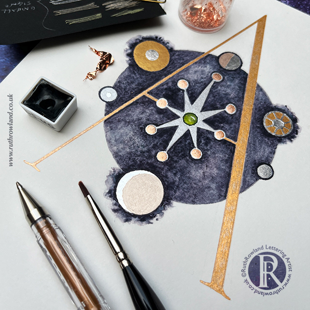 Lettering Artist UK London Ruth Rowland - Capital Letter A with silver gilded star and watercolour circle - photo of worksheet with pen, brush, paint and gold leaf
