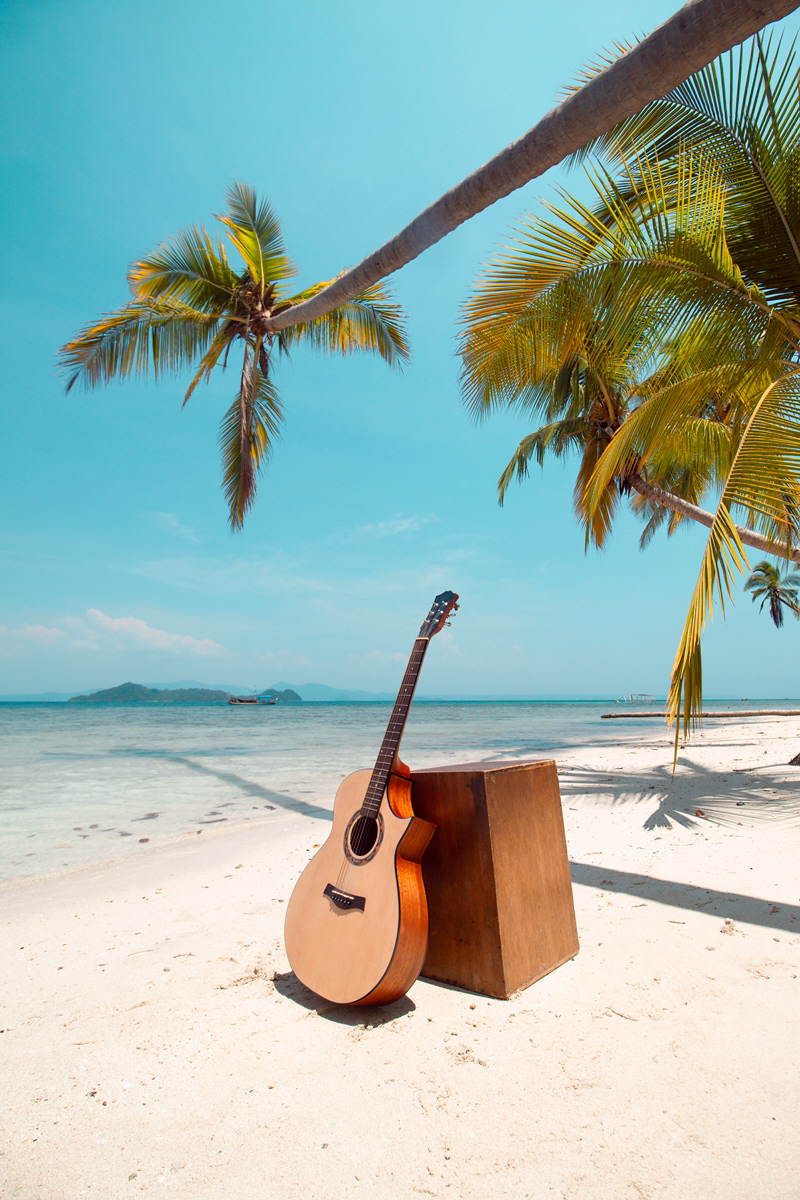 Guitar and cajon on beach