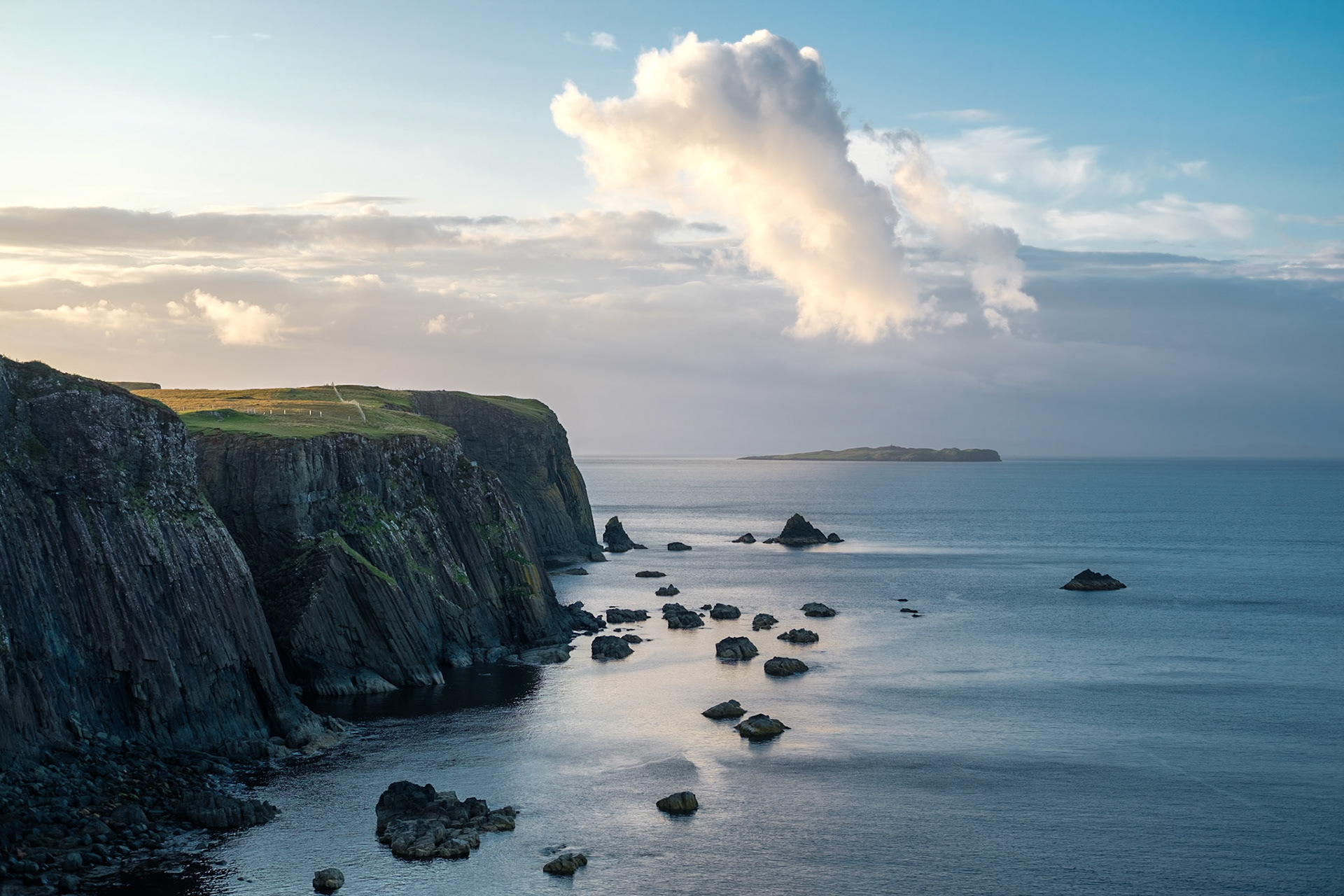 Cliffs, Rocks and a Cloud