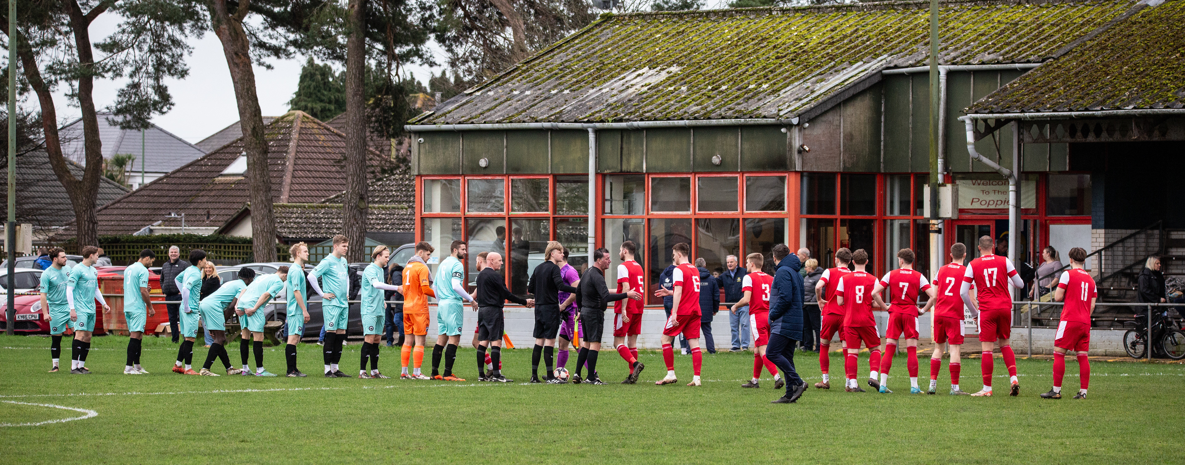 The teams shake hands at Victoria Park