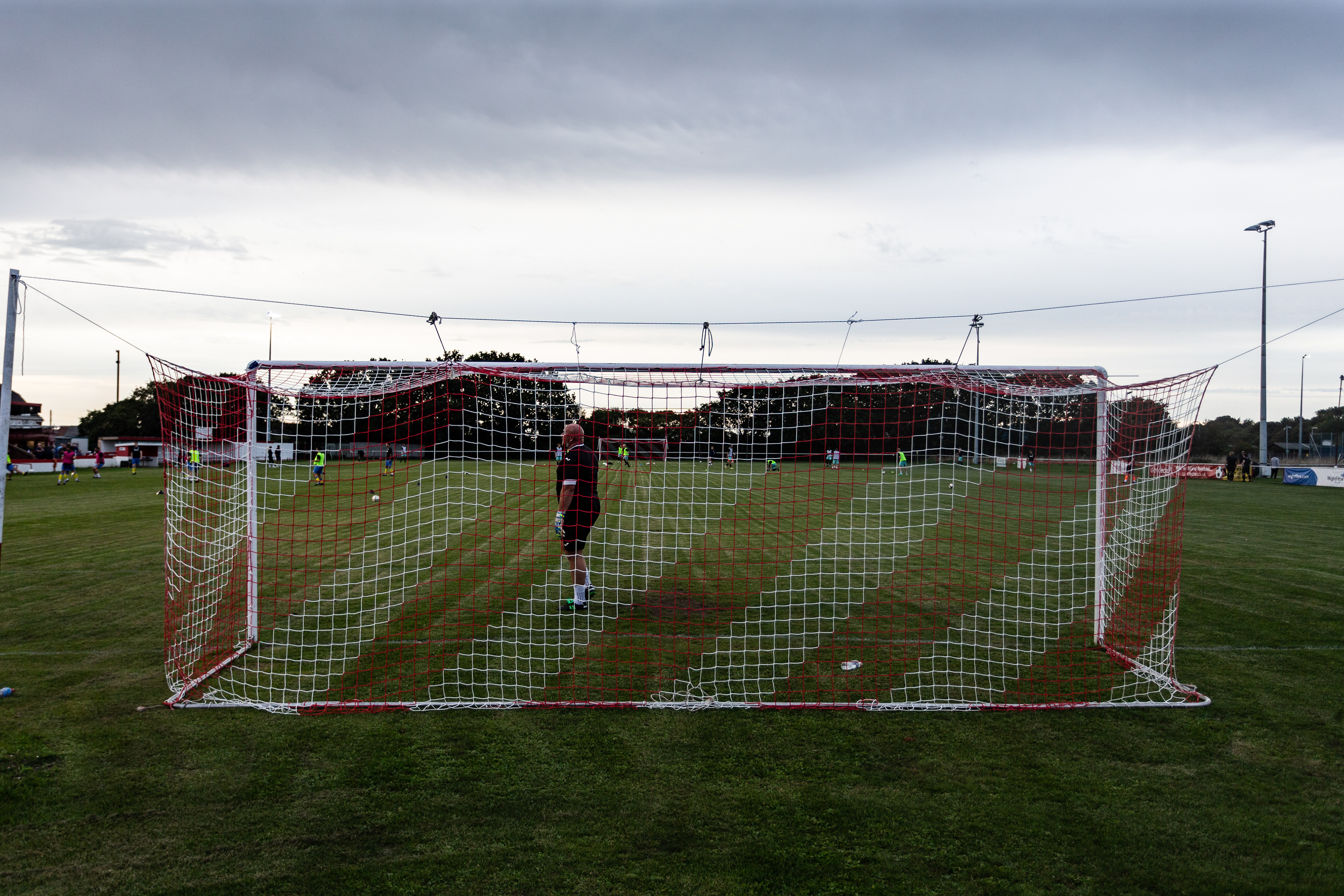 The goal keeper warms up at East Cowes Vics