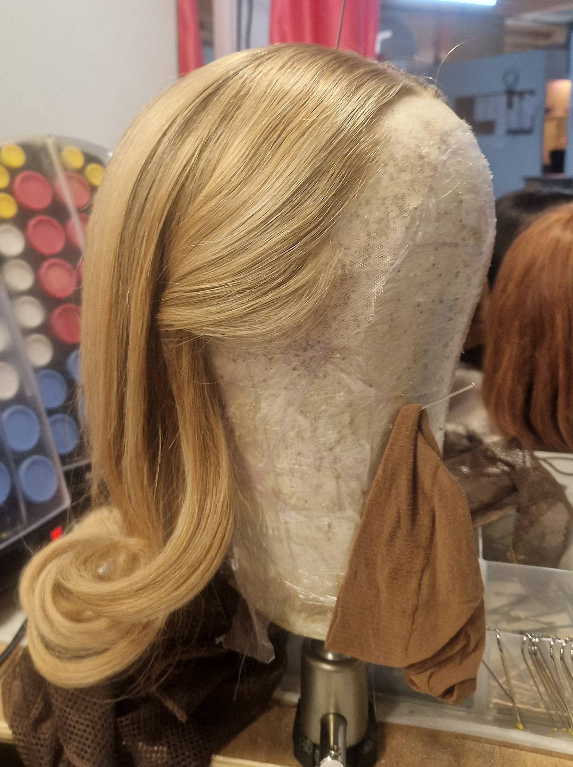 Carol's wig (in this role Phoebe Newlan)