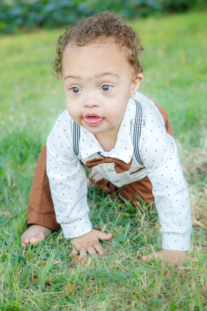 Toddler boy on grass with smile
