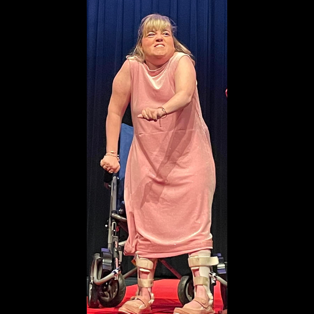 Marisa wore her Roselle Blush Glitter Sheath Dress at the fashion show in May 2022.