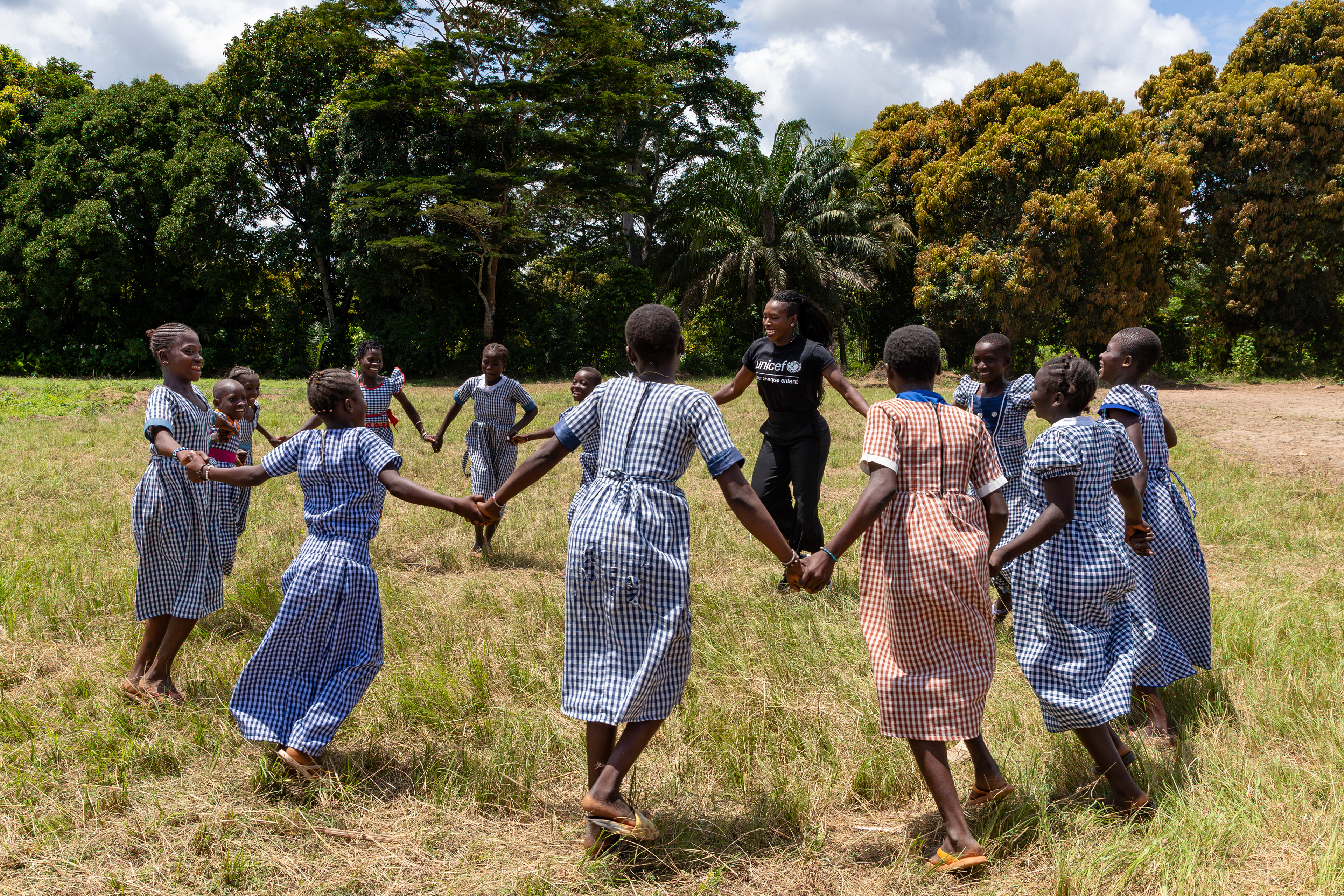 On October 16, 2024, UNICEF Ambassador Murielle Ahouré Demps plays with young girls in the courtyard of the primary school in Tchebakro, South-West Côte d’Ivoire. This joyful interaction highlights UNICEF’s commitment to supporting education and empowering youth in West Africa. Captured by West Africa-based photojournalist and filmmaker Miléquêm Diarassouba.Captured by Miléquêm Diarassouba, Photojournalist West Africa.