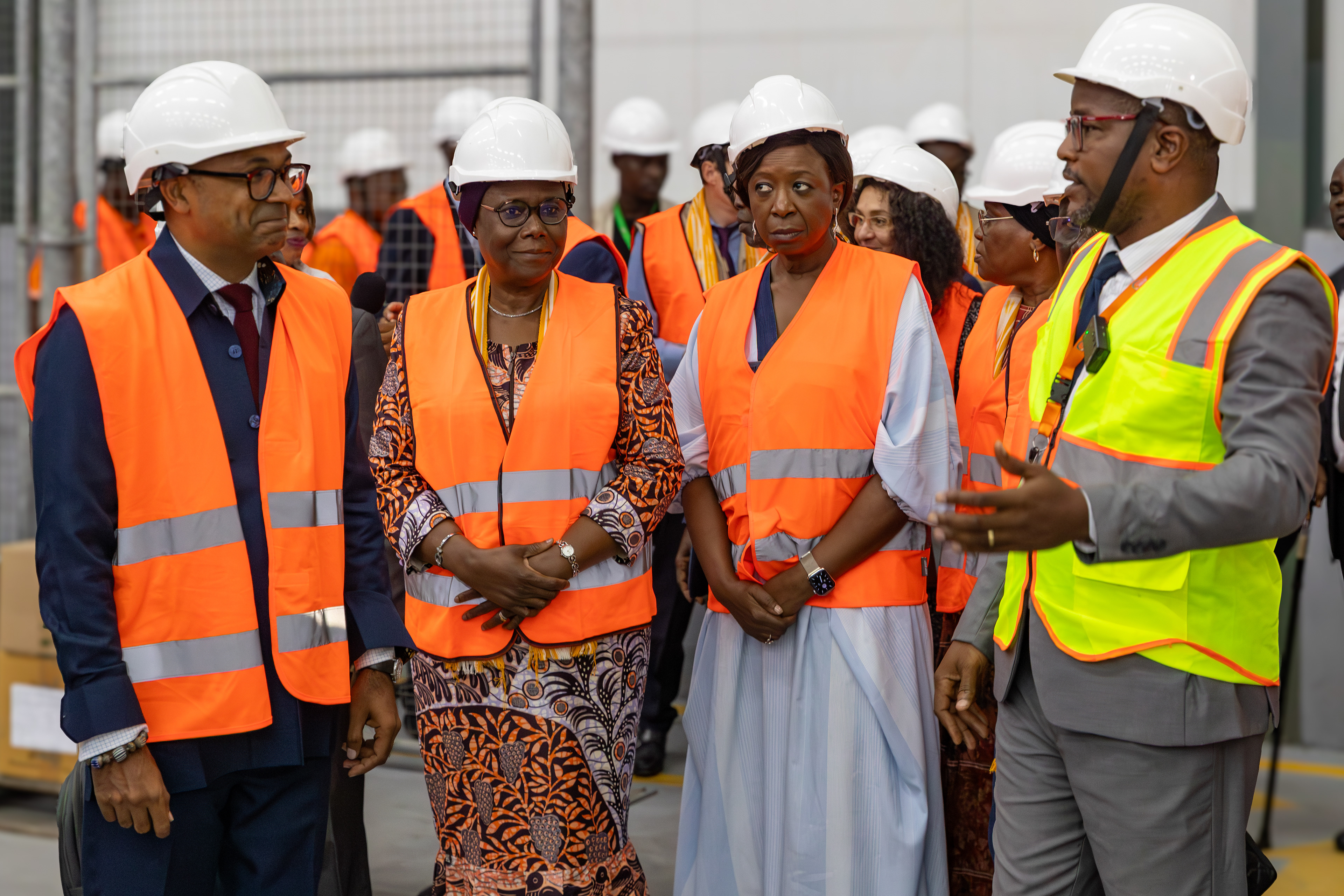 UNFPA Executive Director Dr. Diene Keita visiting the NPSP warehouse in Abidjan on 9 September 2025, accompanied by officials and wearing protective vests and helmets. The visit highlighted the country’s pharmaceutical supply and distribution system. Image by Miléquêm Diarassouba, photojournalist West Africa.
