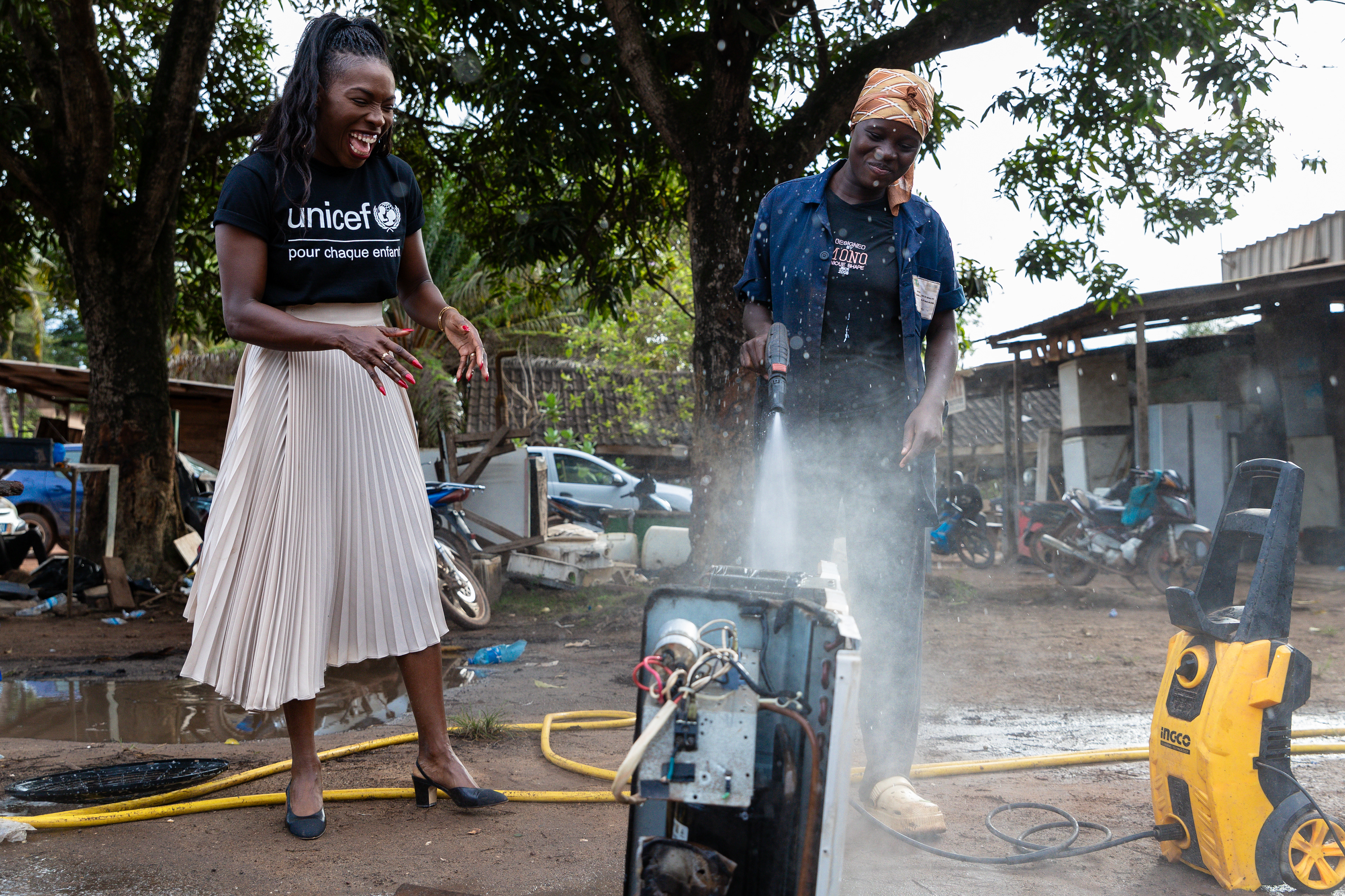 During her visit to San Pedro, South-West Côte d’Ivoire, on 14th October 2024, UNICEF Ambassador Murielle Ahouré Demps meets 17-year-old Élodie, who is cleaning an air conditioning unit with a pressure washer as part of her cold chain training.Captured by Miléquêm Diarassouba, Photojournalist West Africa.