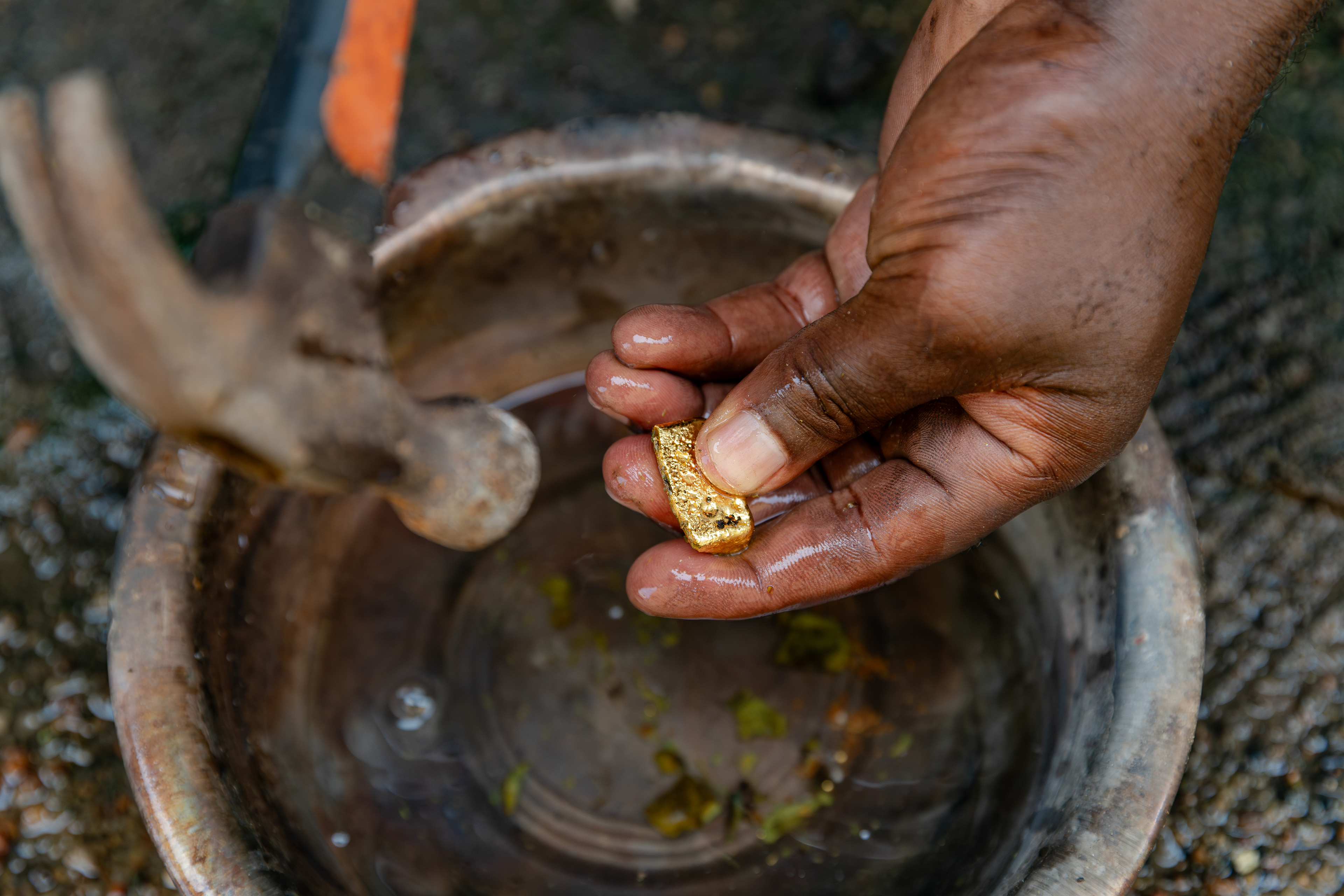 Freshly cast, the gold bar is removed from the mold and cooled before inspection.