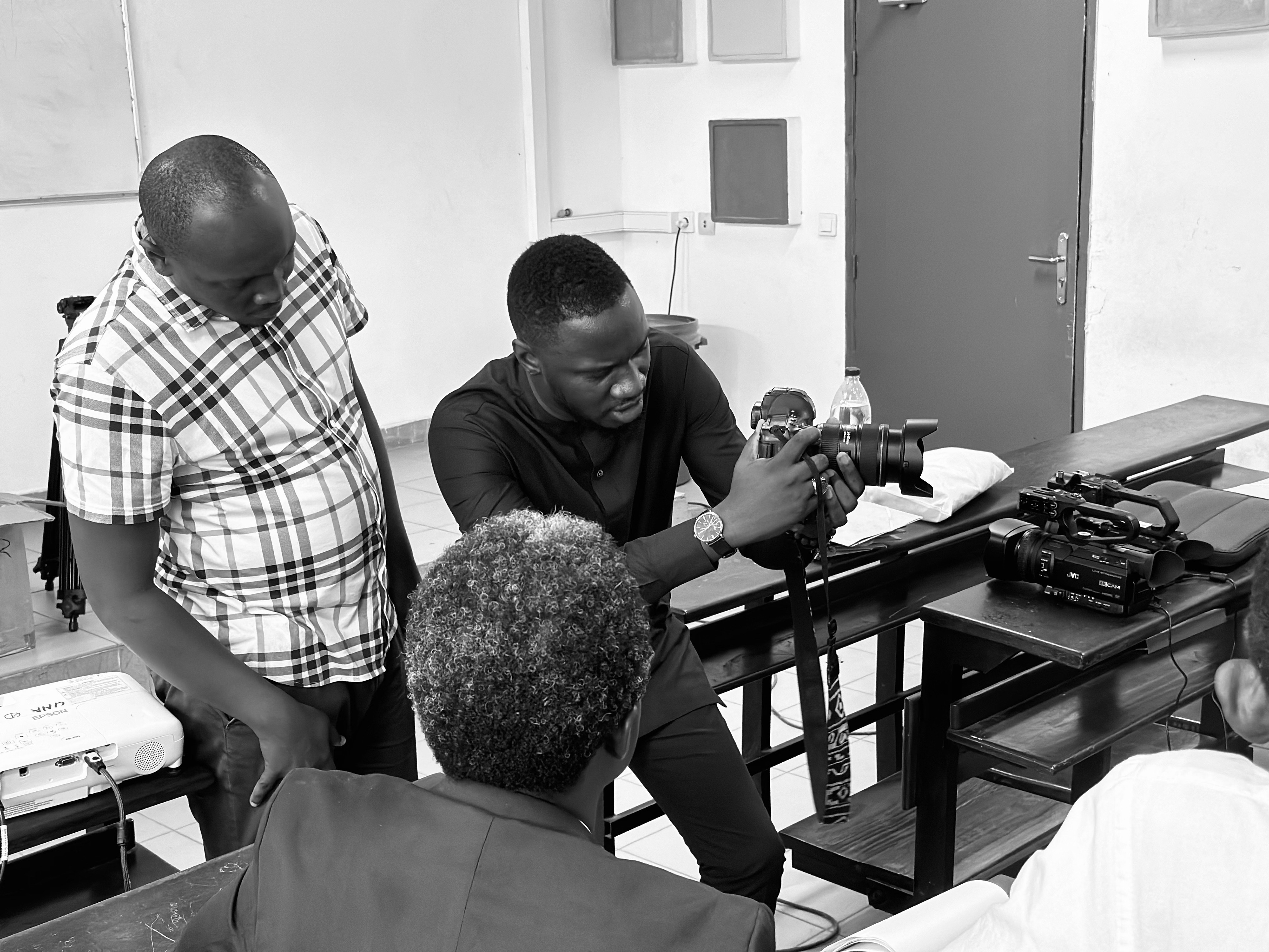 Communication service member at Miléquêm Diarassouba’s photography workshop at Université Nangui ABROGOUA, Abidjan, Côte d'Ivoire, 30 January 2024, using professional equipment.