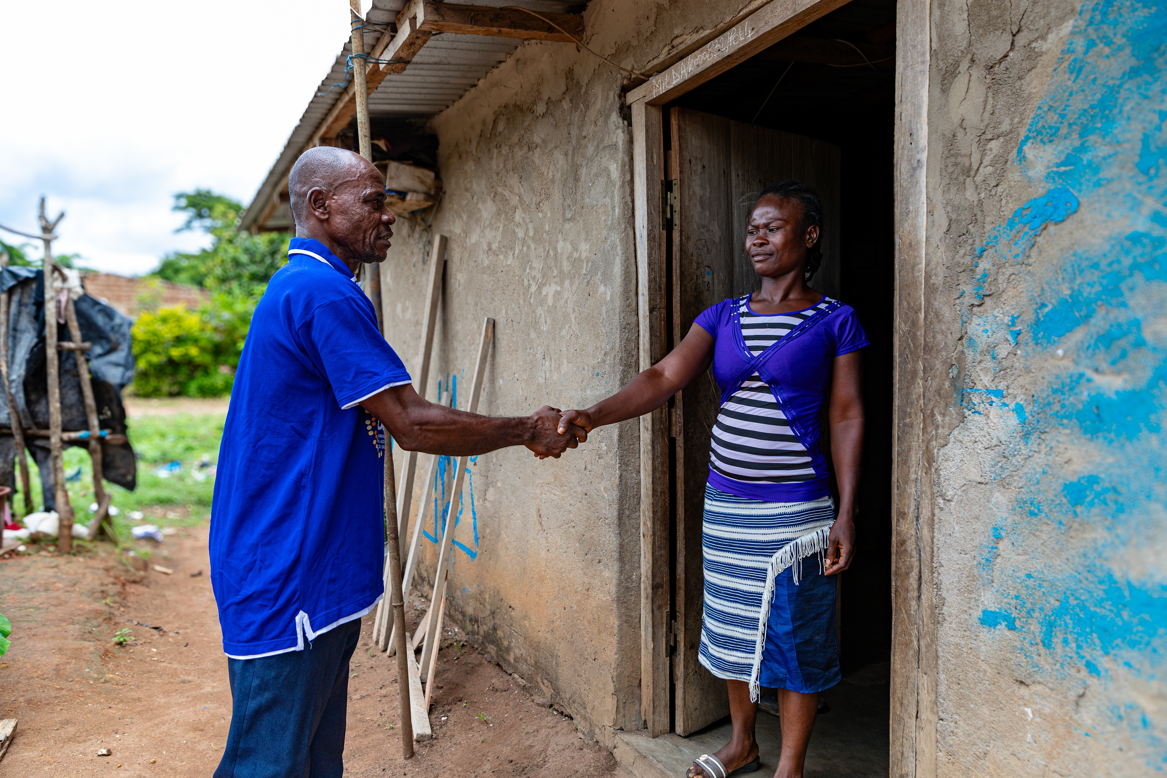 Digbeu Zeze Sylvain, a DREAMS Godfather, came to talk to a woman who called on him to resolve a conflict in the village of Zokoguhé, 18 km from Daloa in western Côte d'Ivoire, on 29 June 2024.